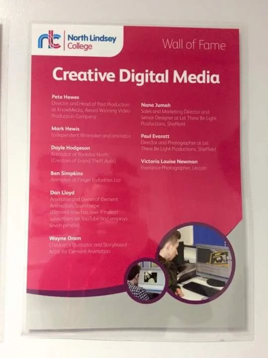 Poster titled 'Wall of Fame' for 'Creative Digital Media' featuring a list of names and titles of various professionals, with a photo of two people working on computers at the bottom.