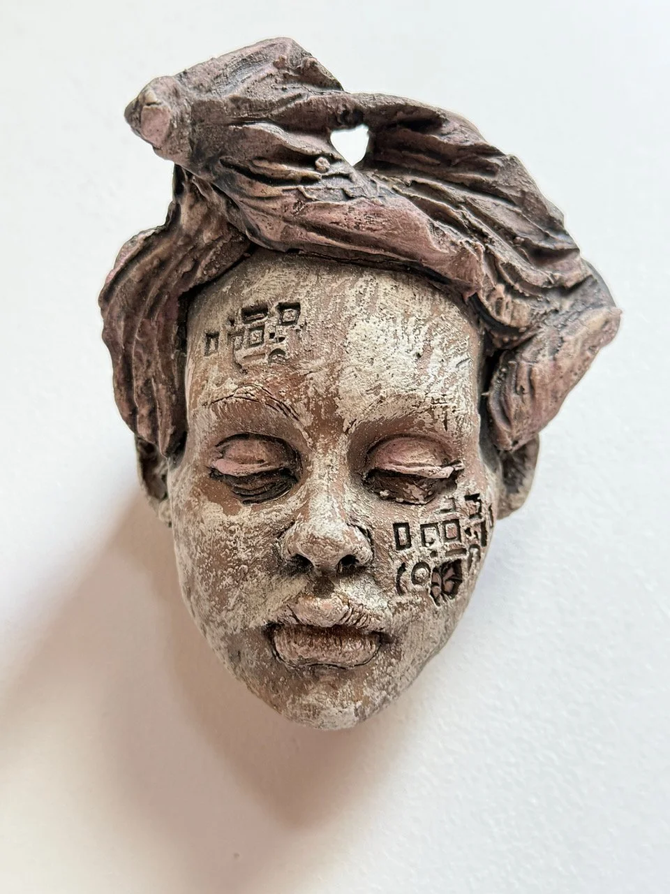 “Non Binary” Wall Head. 5”hx3.5’wx4’d. Clay.