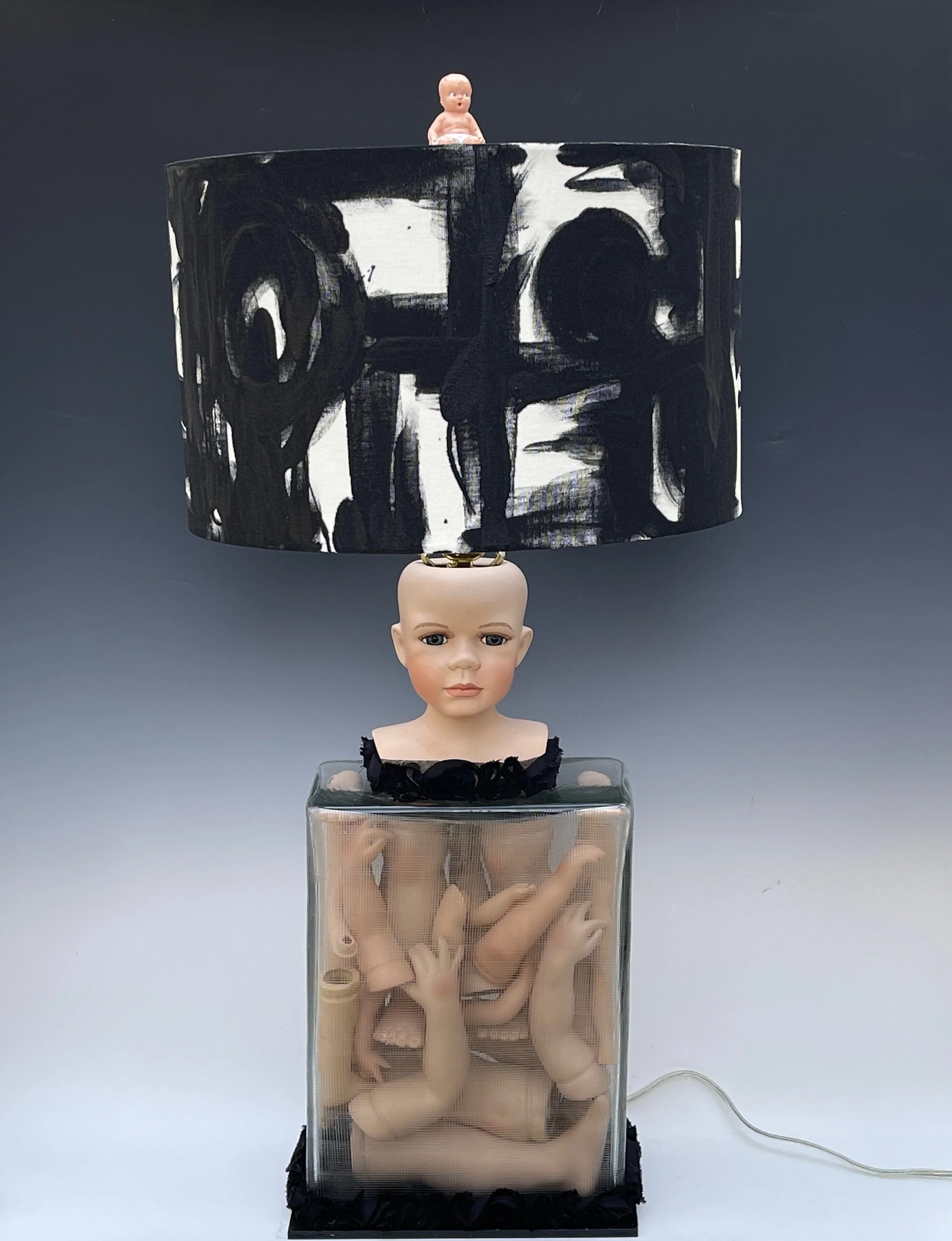 "Doll Lamp". 32” high to top of baby finial. 10”w x 6”d. Lampshade is 14.5” diameter
