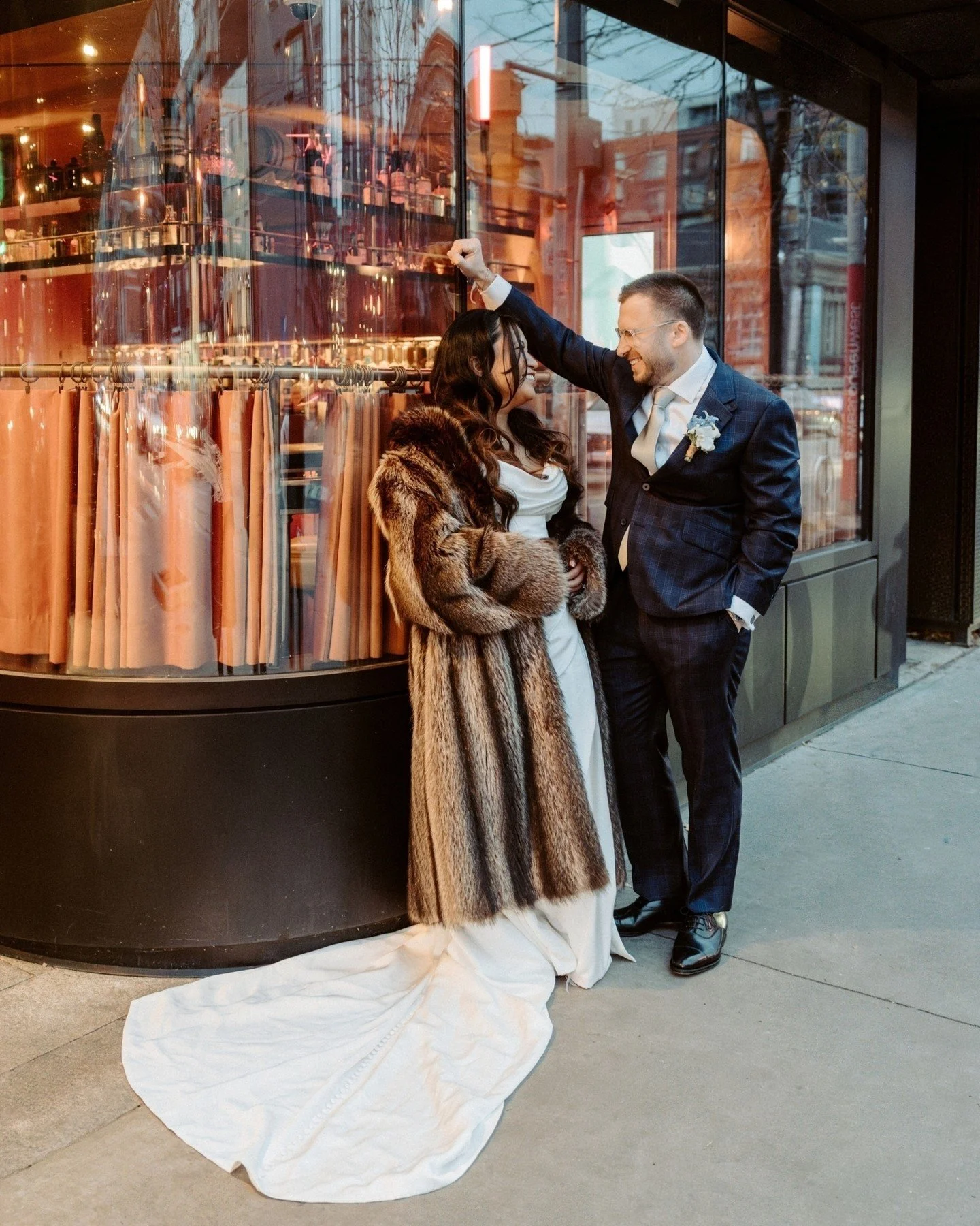 Danielle and Amir wanted their reception to feel like their living room. And somehow, inside Twist Gallery on Queen West, that's exactly what it did.

A burn-away cake that revealed the plot twist their closest people had been waiting four months for