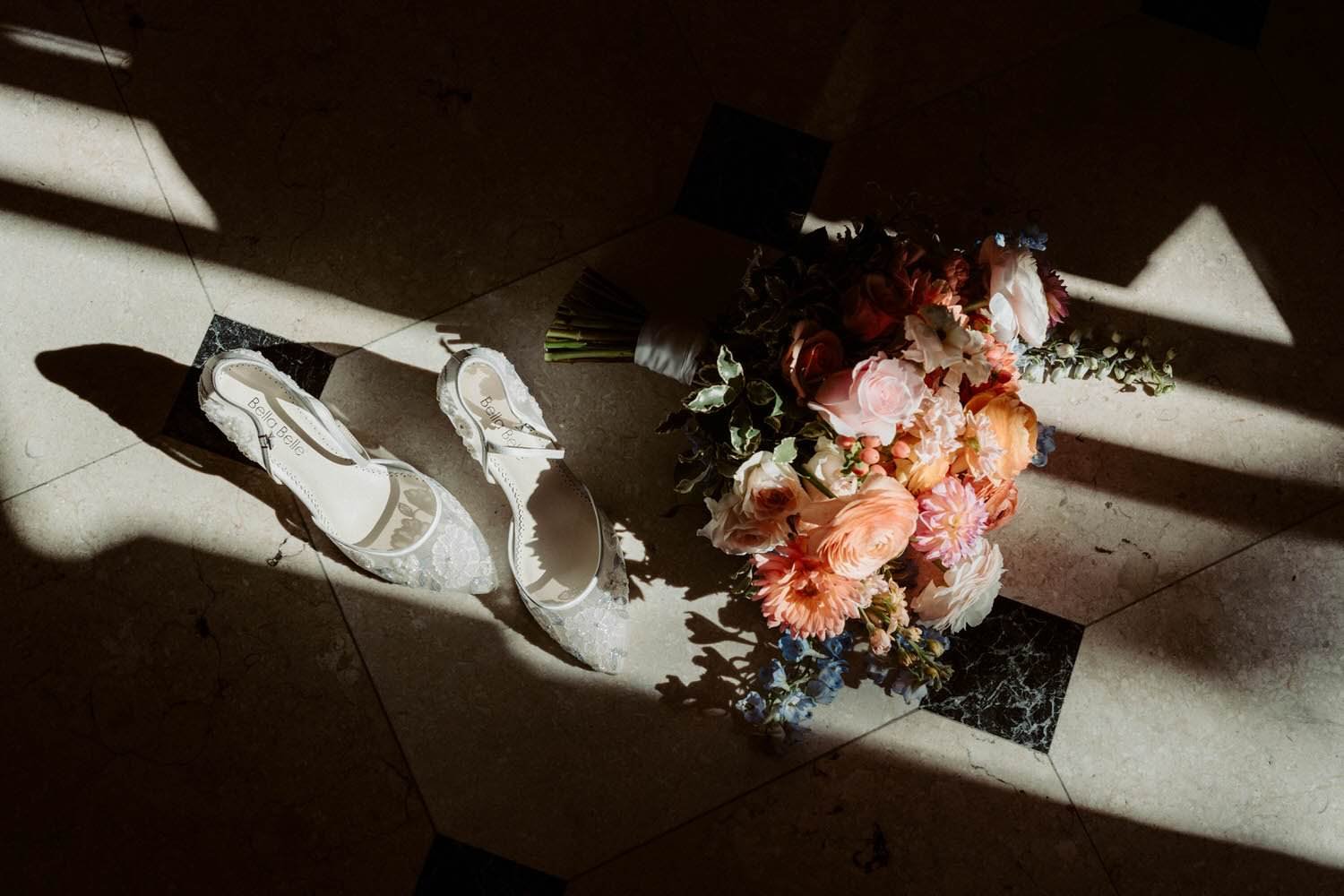 Wedding bouquet and lace bridal heels detail at Toronto Graydon Hall Manor wedding by Ontario wedding photographer - Amare Studios