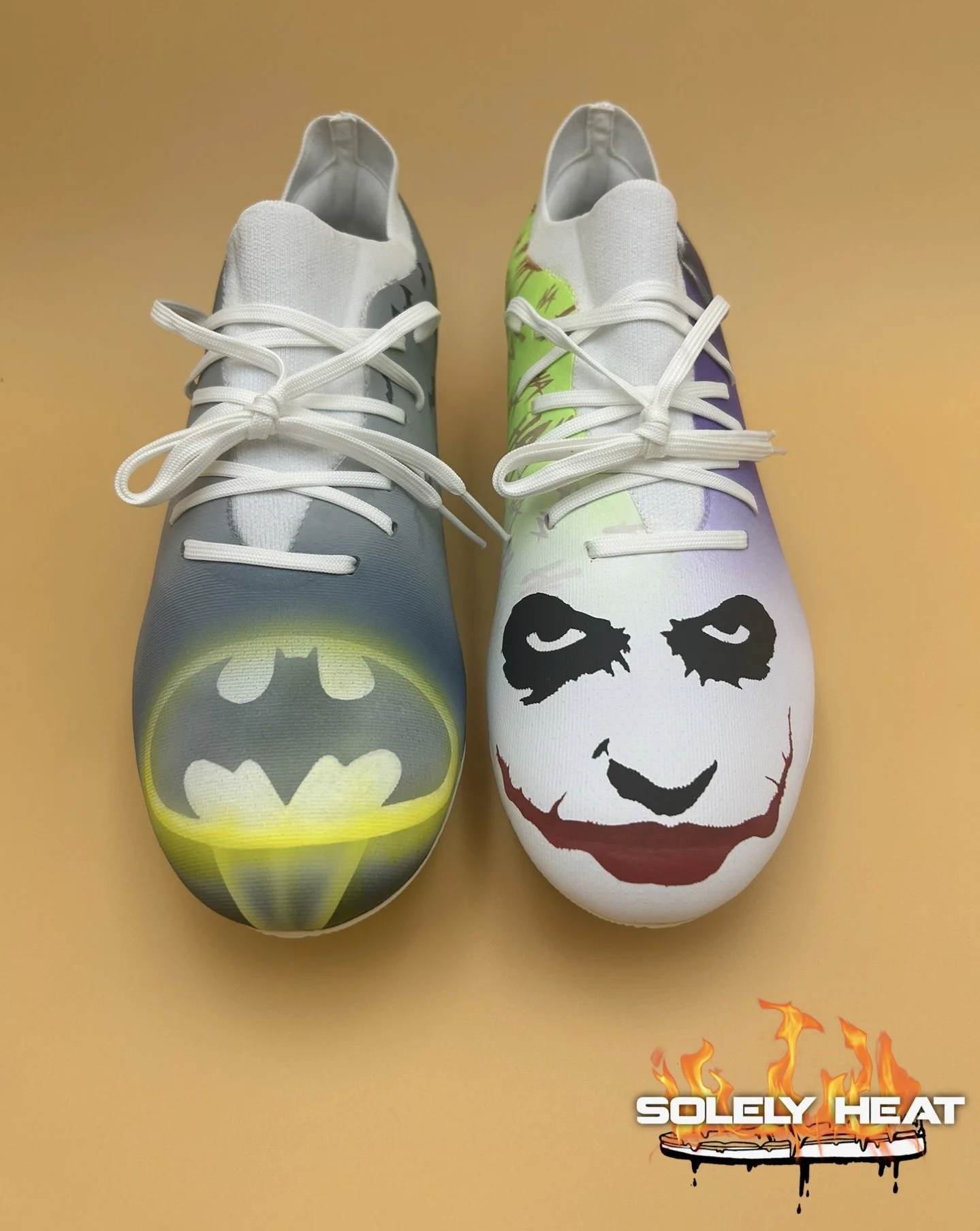 Batman and Joker-inspired custom footwear with hand-painted toe artwork by Solely Heat