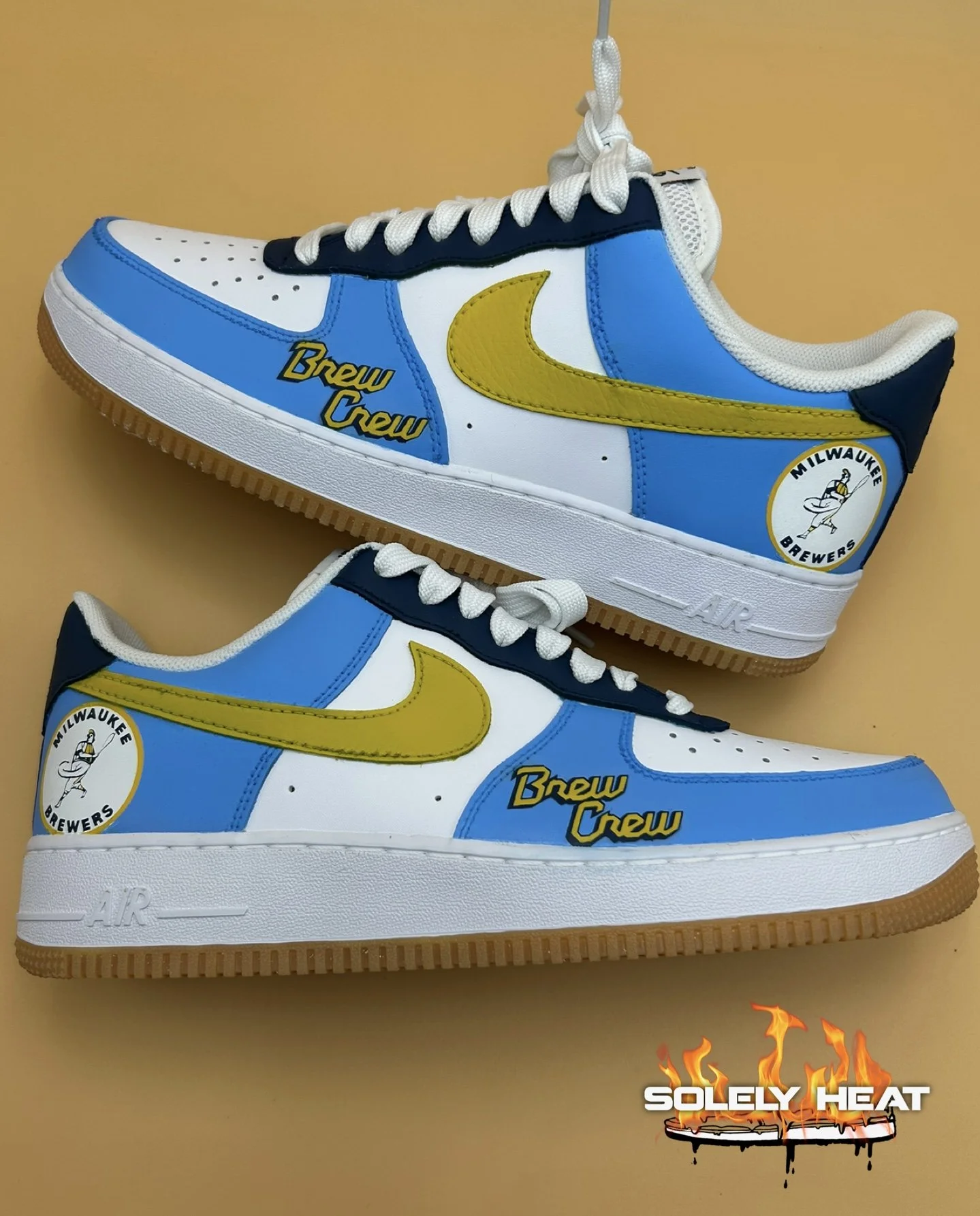 Hand-painted blue, yellow, and navy Brewers-inspired Air Force 1 pair by Solely Heat
