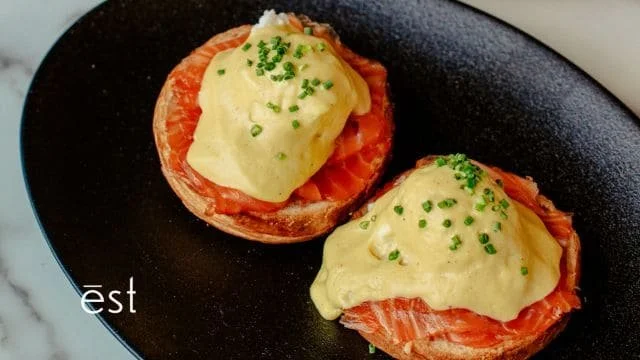 salmon and egg benedict on a bagel