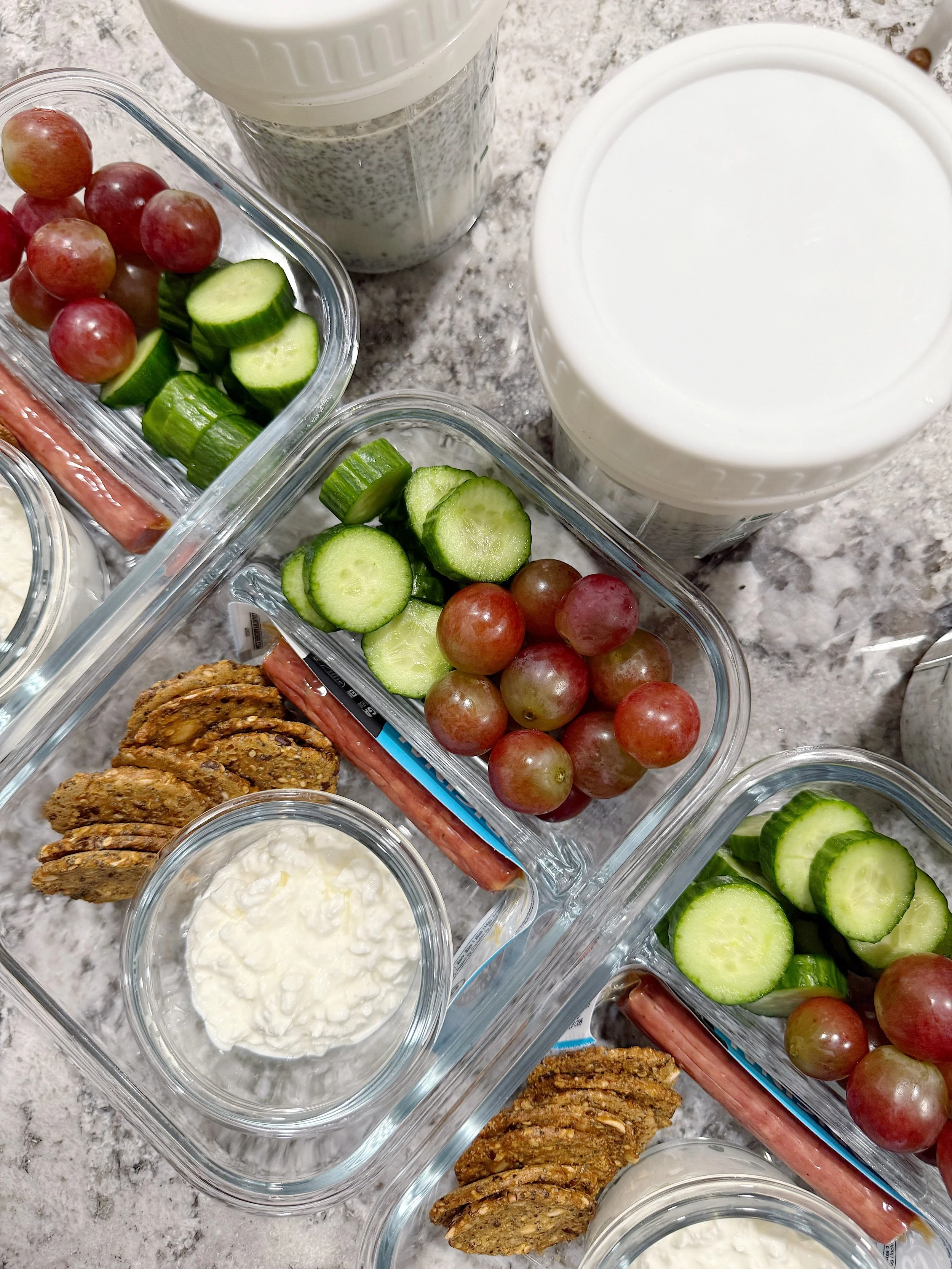 Fridge organized with clear containers and prepped meals