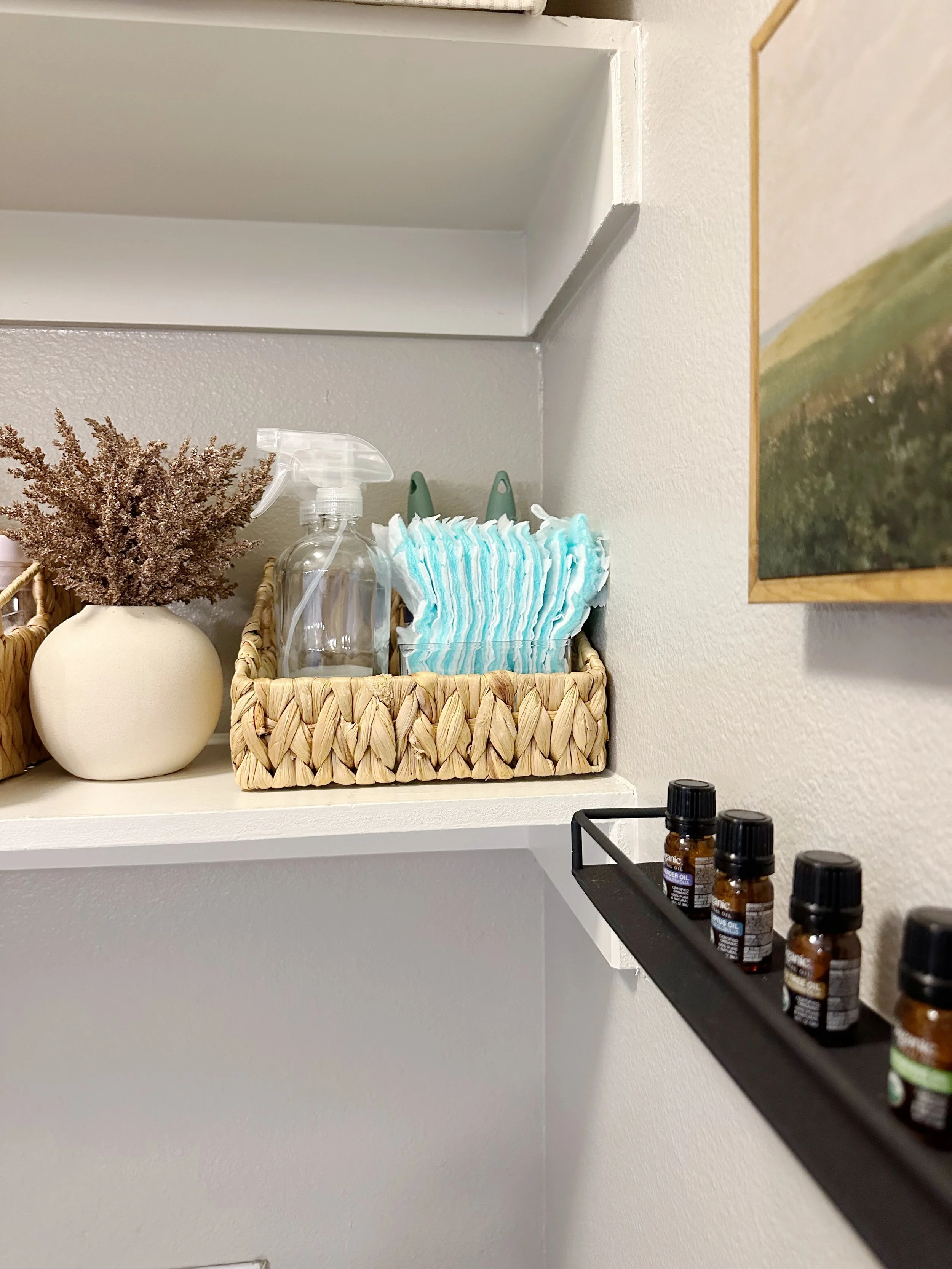 Laundry room with labeled baskets and folded linens for easy sorting