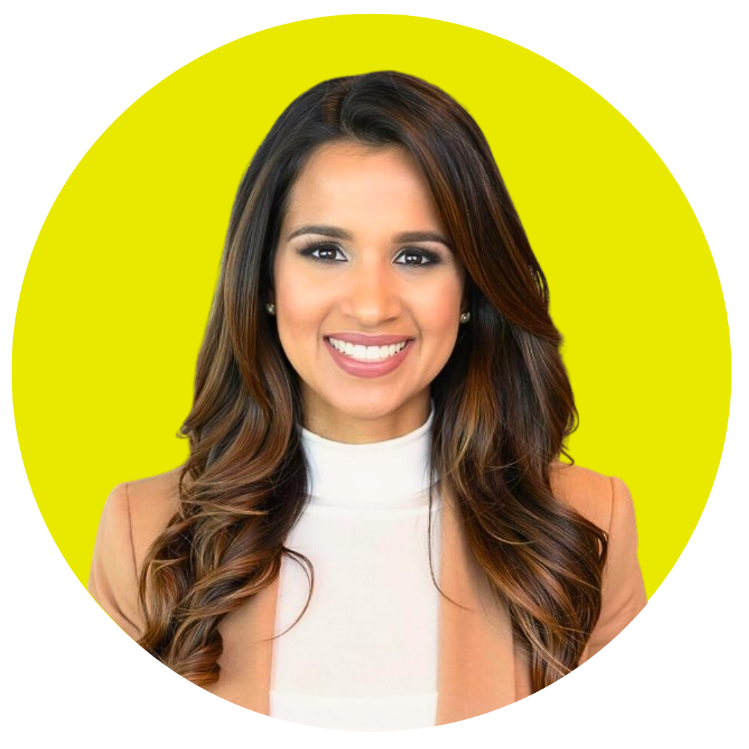 A woman with long brown hair smiling against a yellow background.