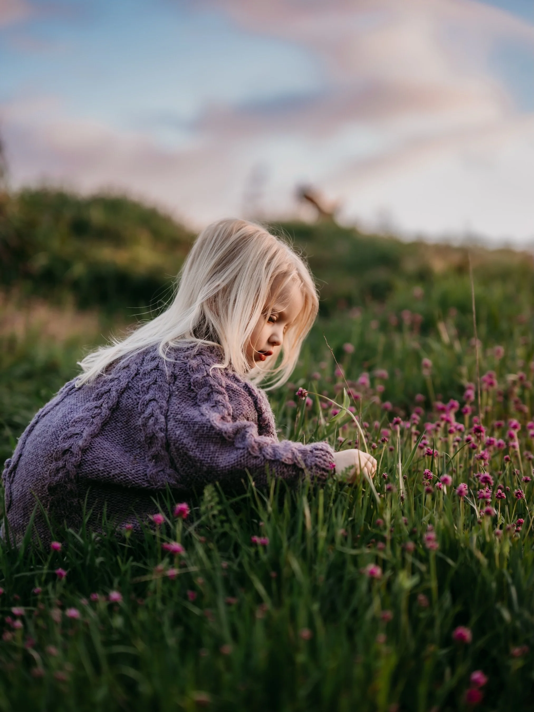 Truth be told, I take a lot of photos of her. I mean, can you blame me?😉These are some of my recent favorites. 

Lying in the grass, blowing dandelions and picking flowers. Just living her best life.✨💜