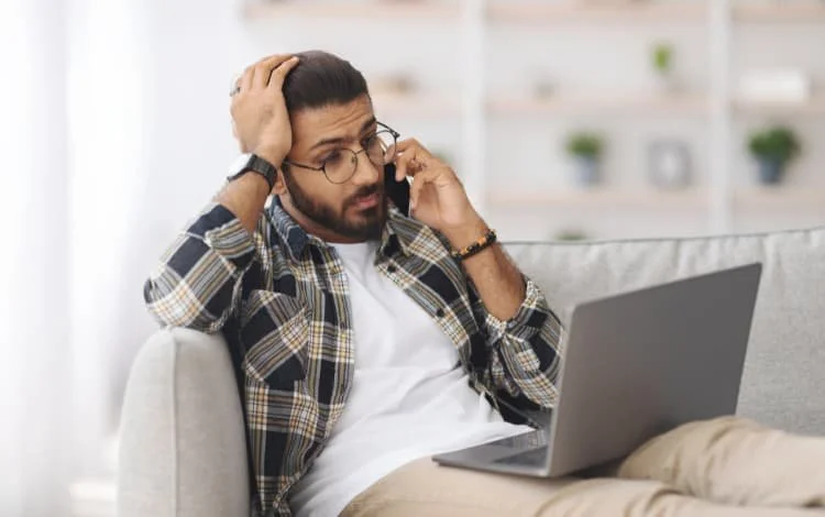Stressful guy on his laptop