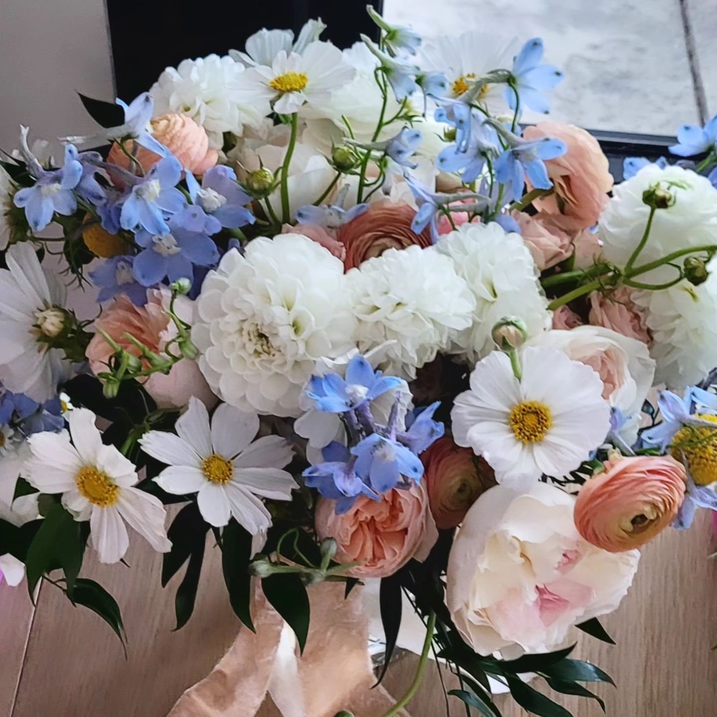 Natural gathering of #SpringtimeBlooms #WeddingFlowers #BridalBouquet #DesignedByRainyDiane #PassionAndWeeds #GardenRoses #Cosmos #Ranunculus #Delphinium #BallDahlia #Delphinium