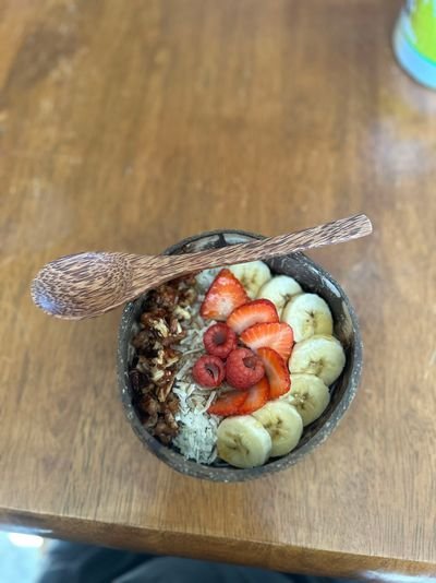 Banana coconut steel oats. I added sliced strawberries, a few raspberries, candied pecans, toasted coconut, chia sprinkle and hemp seed heart sprinkle topped with maple syrup.jpeg