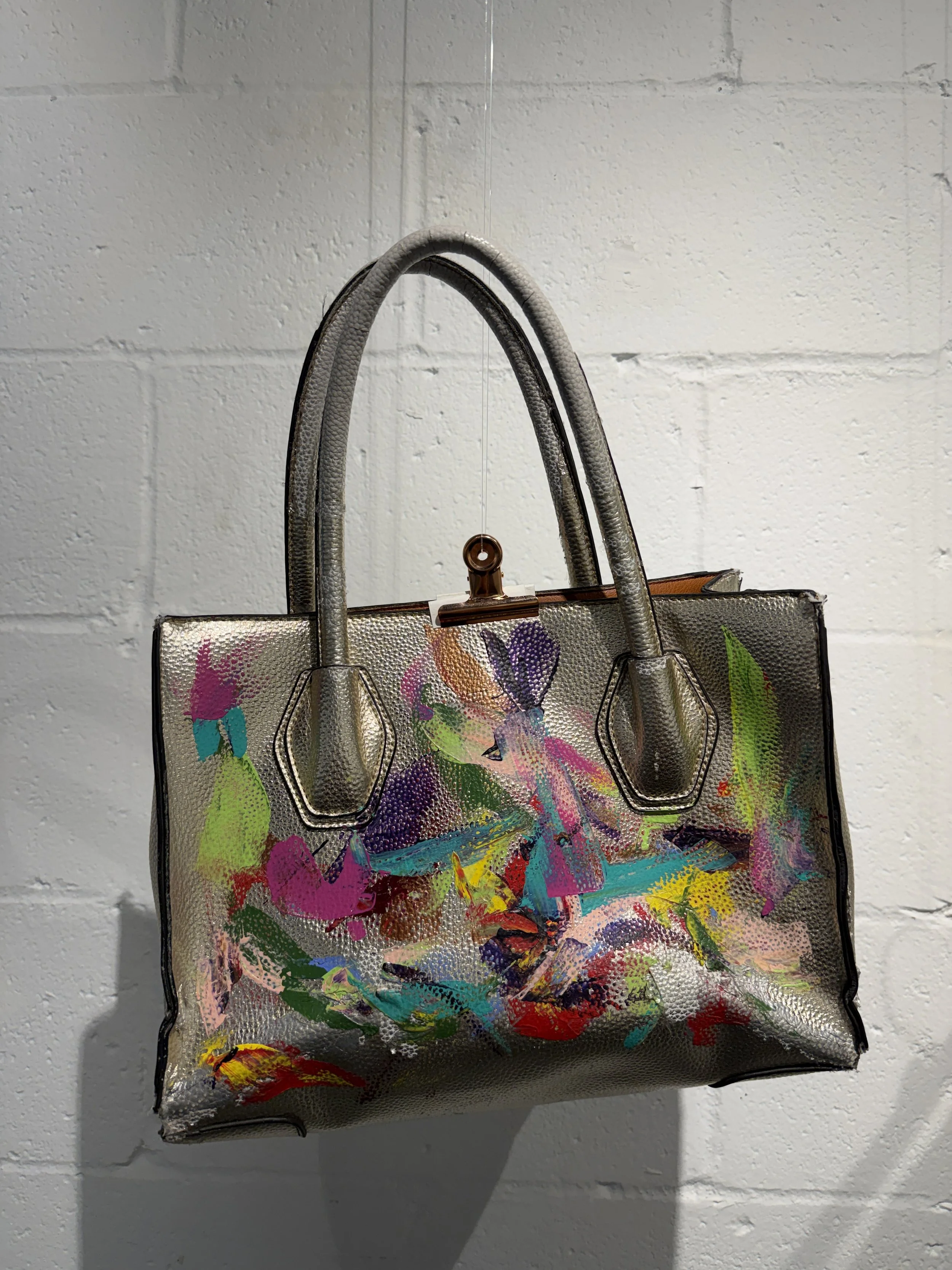 "Carrying Light" hand-painted, metallic structured tote bag.
