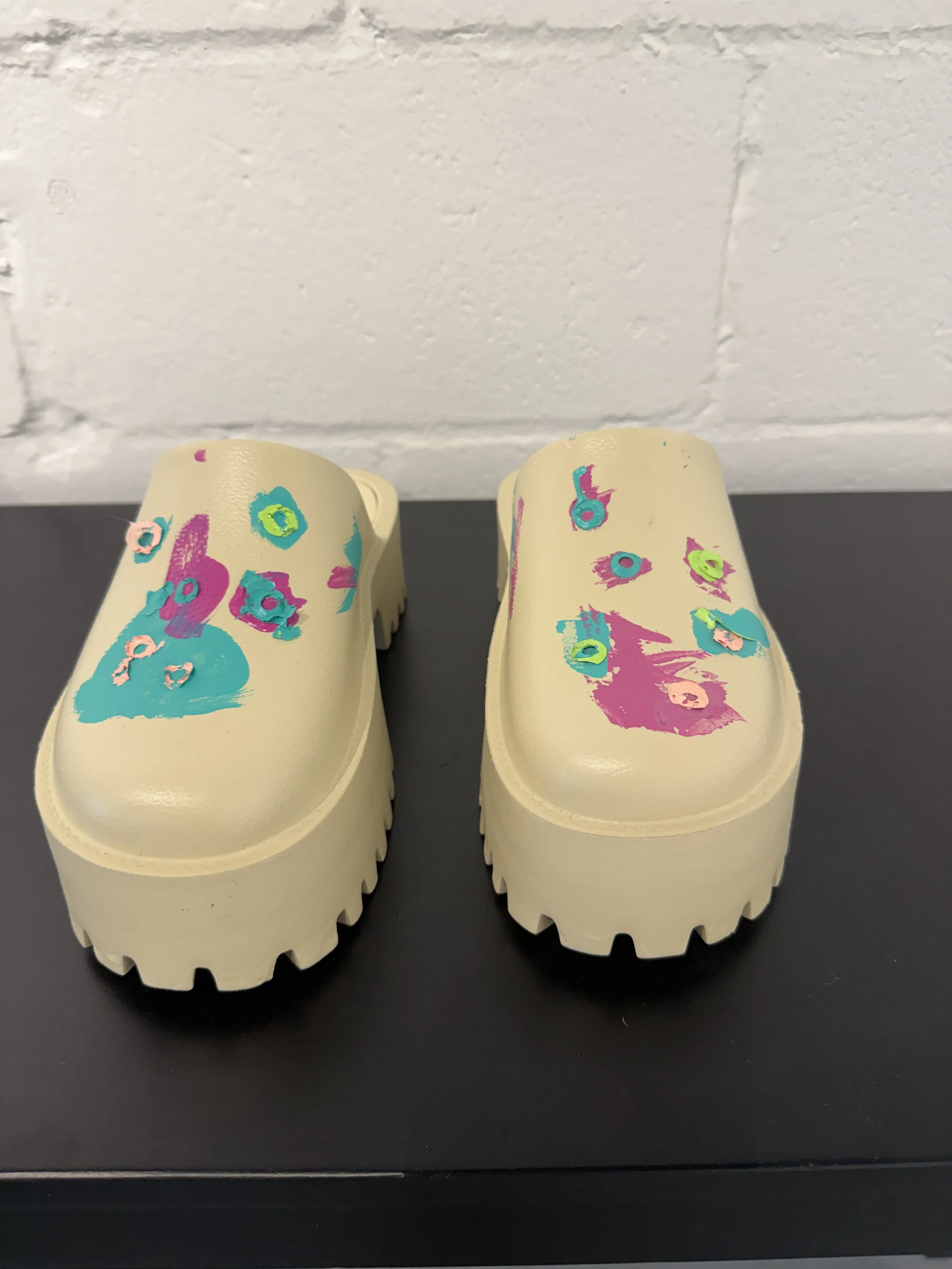 "Play," hand-painted platform slides