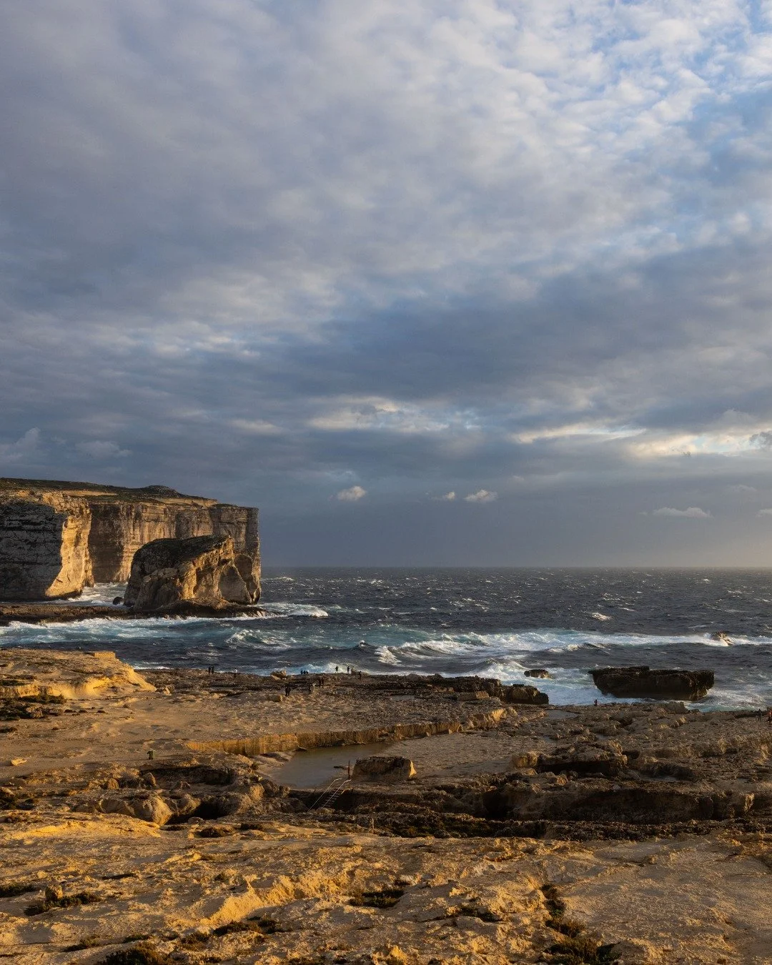 Everyone was facing west, cameras pointed toward the setting sun.

But I turned around.

Sometimes the most breathtaking sight isn't the obvious one. While everyone else was capturing the sunset, I was watching what it was creating - this golden ligh