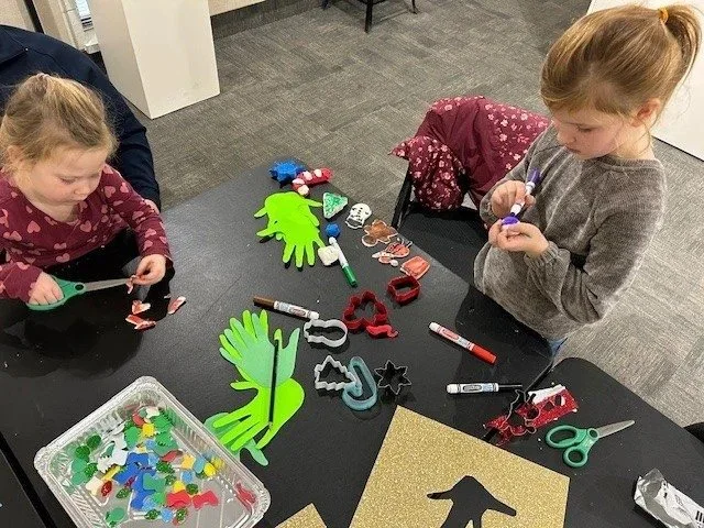 Young artists working on a colourful collage