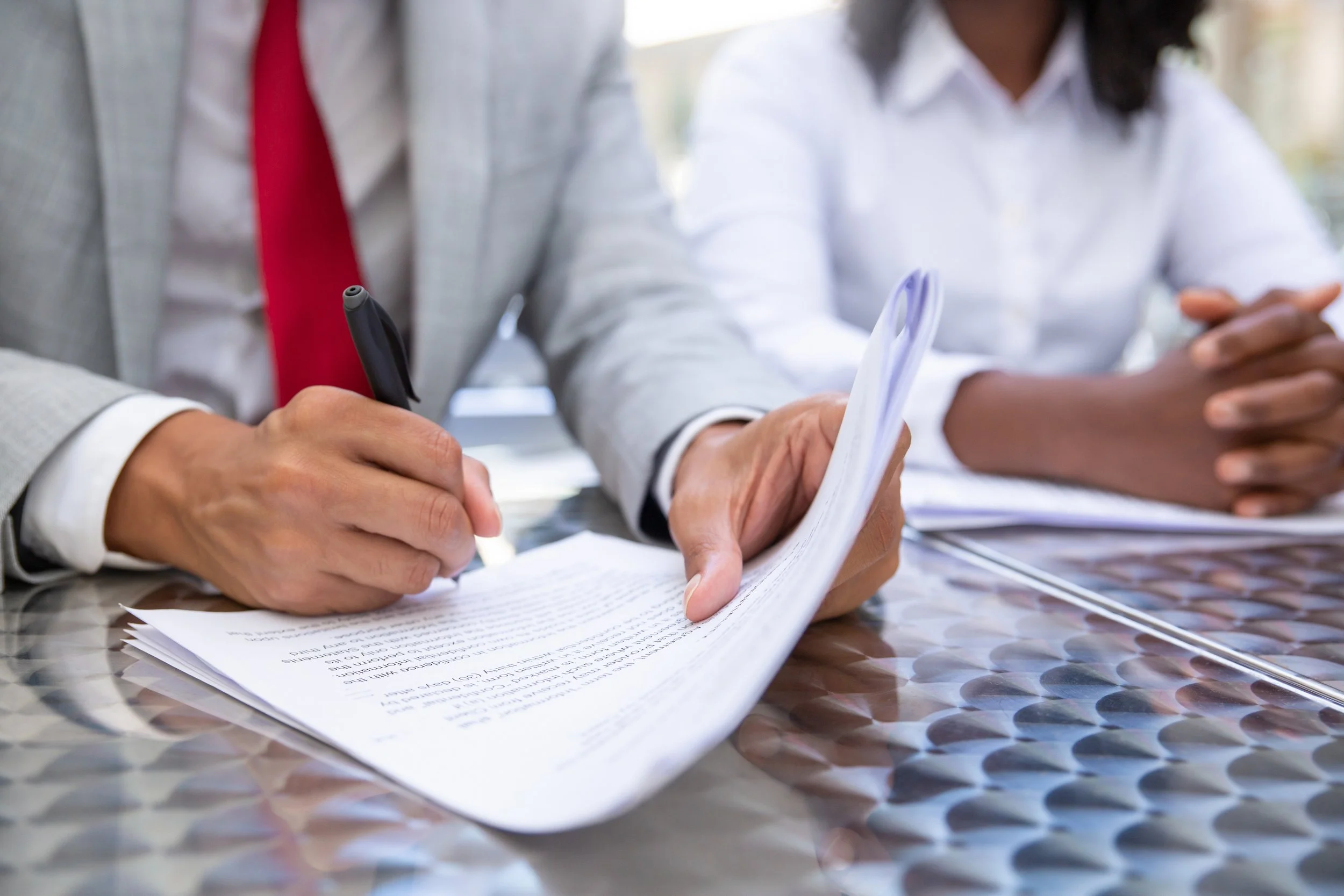 closeup-shot-businessman-signing-documents.jpg