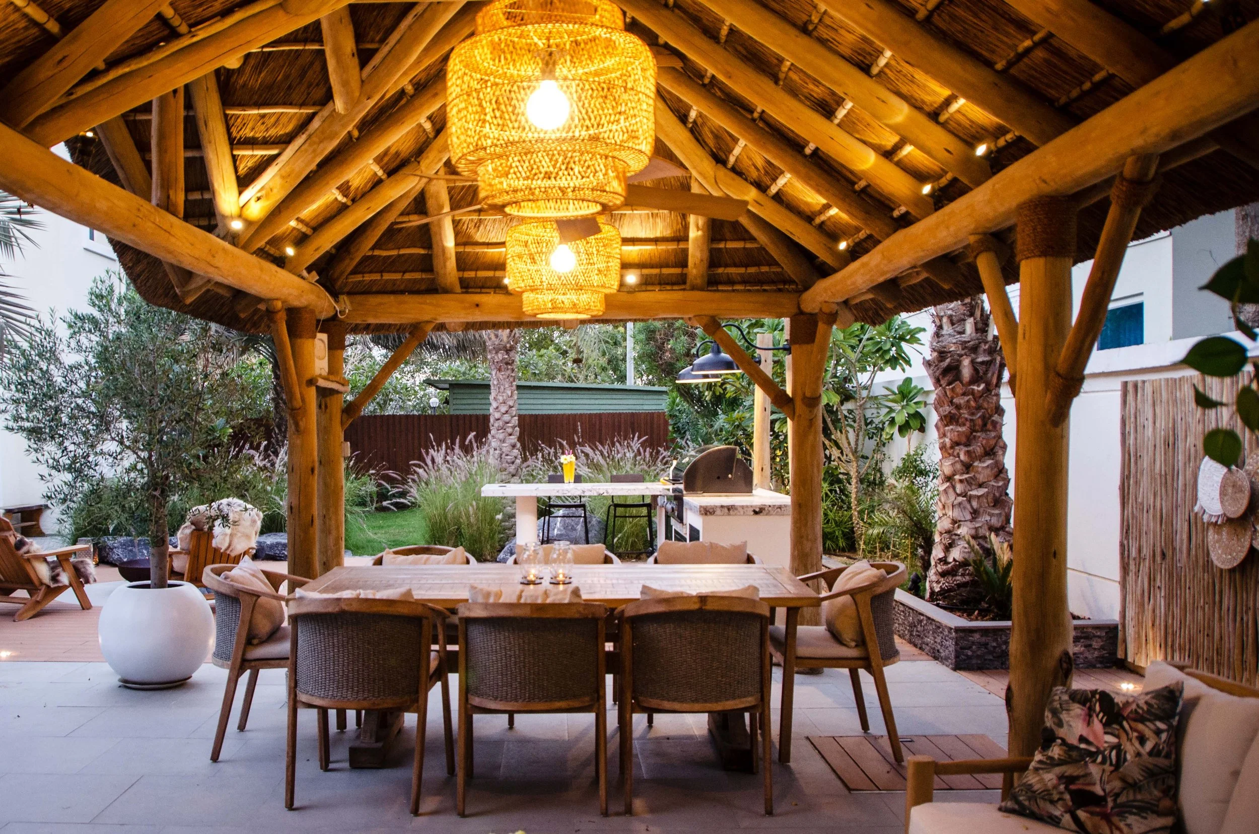 Compound of spaces designed for harmonious living with dining area, outdoor kitchen and BBQ 