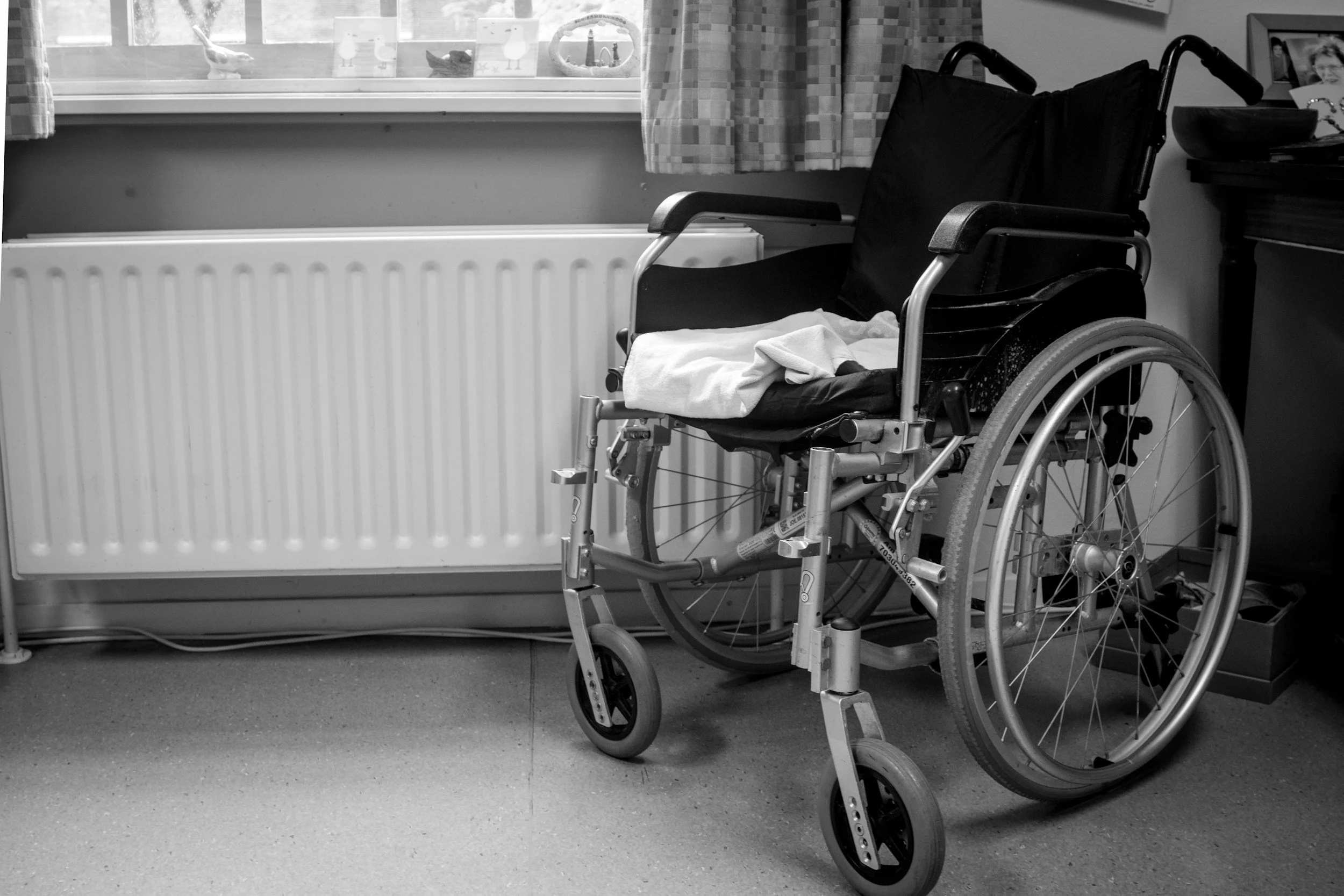 Black and white image of a wheelchair