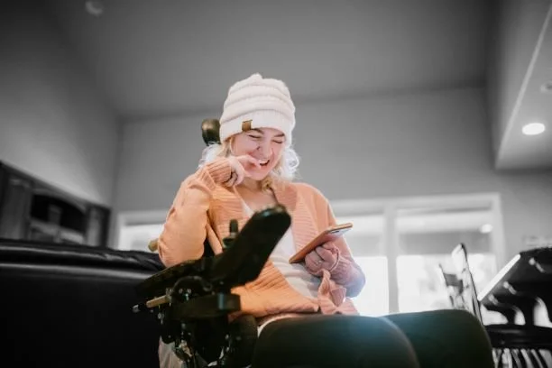 Wheelchair user with mobile phone