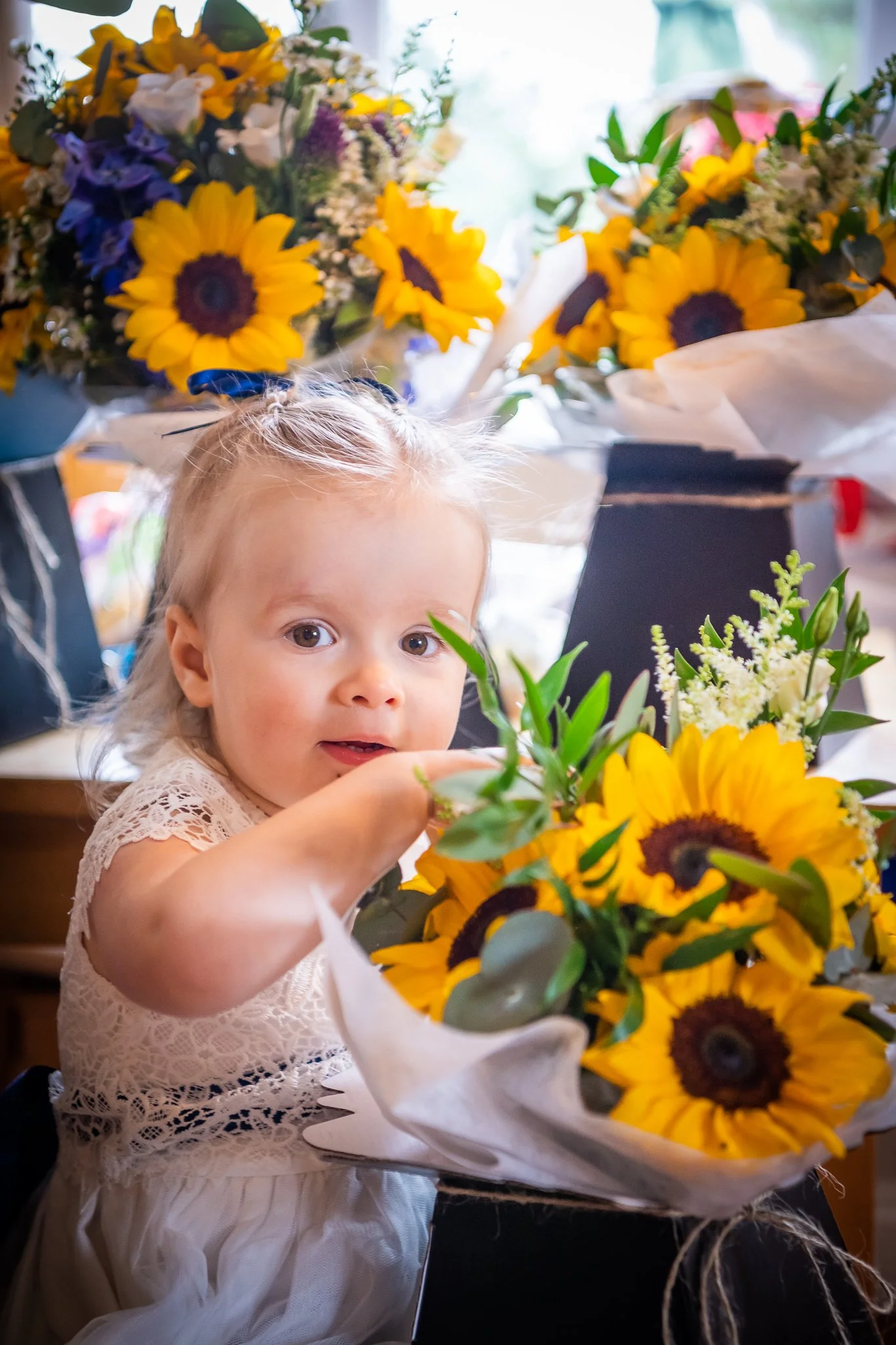 flower girl with wedding bouquet at crewe hall cheshire photographed by UK wedding photographer chris peach photography