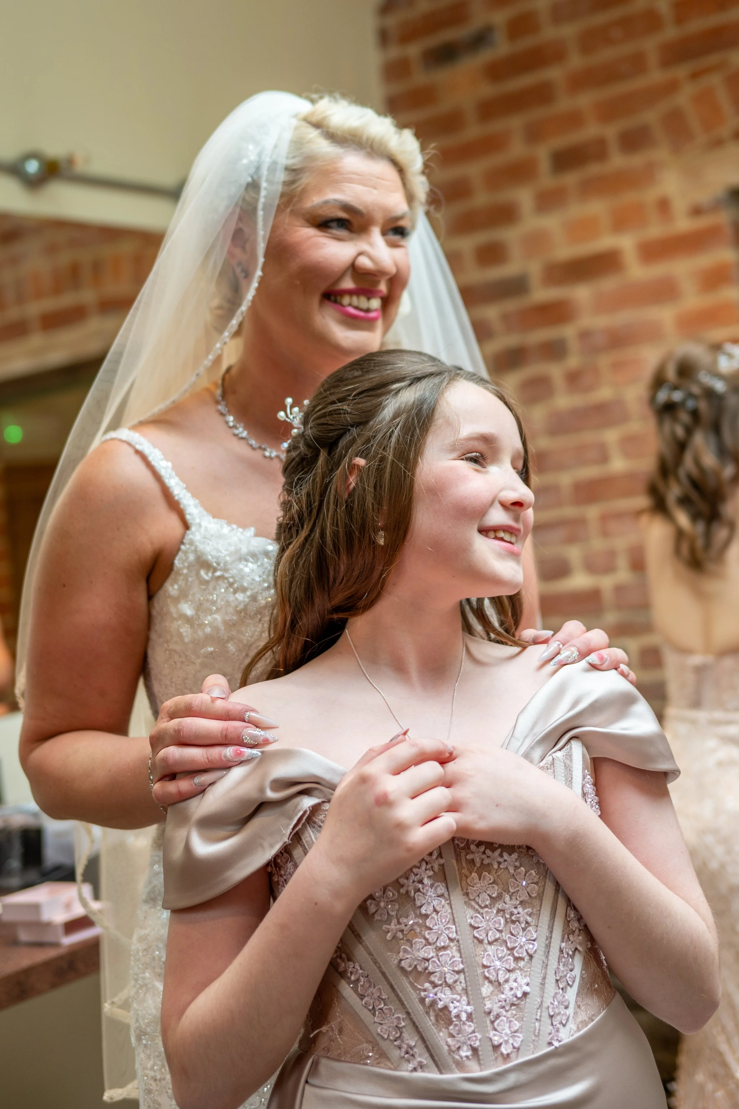 bride and daughter share a moment before their wedding day at foxtail barns in consall staffordshire  photographed by UK wedding photographer chris peach photography