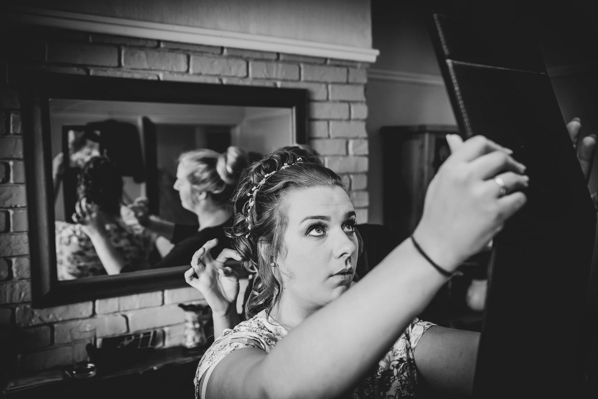 bride getting ready black and white photographed by UK wedding photographer chris peach photography