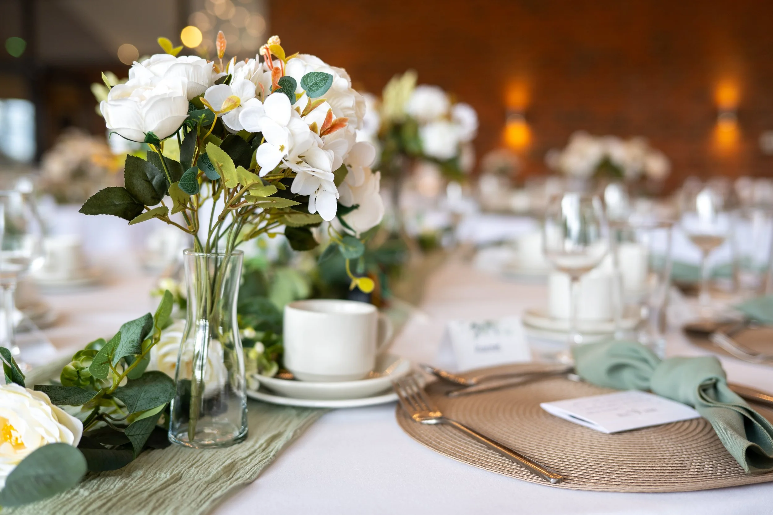 wedding table dressing at aston marina in stone staffordshire bride having her hair and makeup done before her wedding day at dunwood hall estate near leek in staffordshire photographed by UK wedding photographer chris peach photography