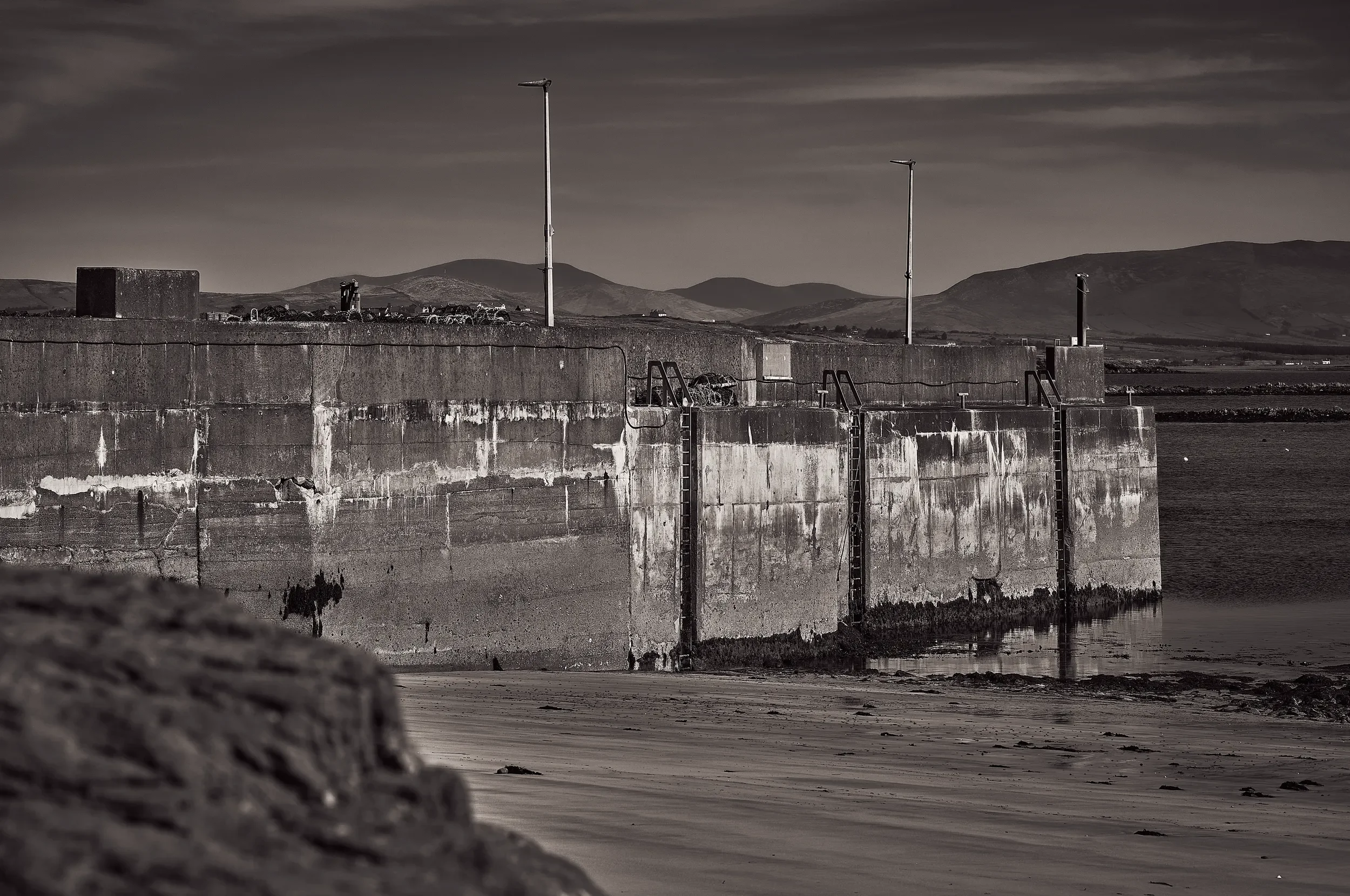   Enduring Walls   / The pier between Atlantic tides and distant hills, waiting for Skellig boat tours / Ring of Kerry, 2025   IRP-011