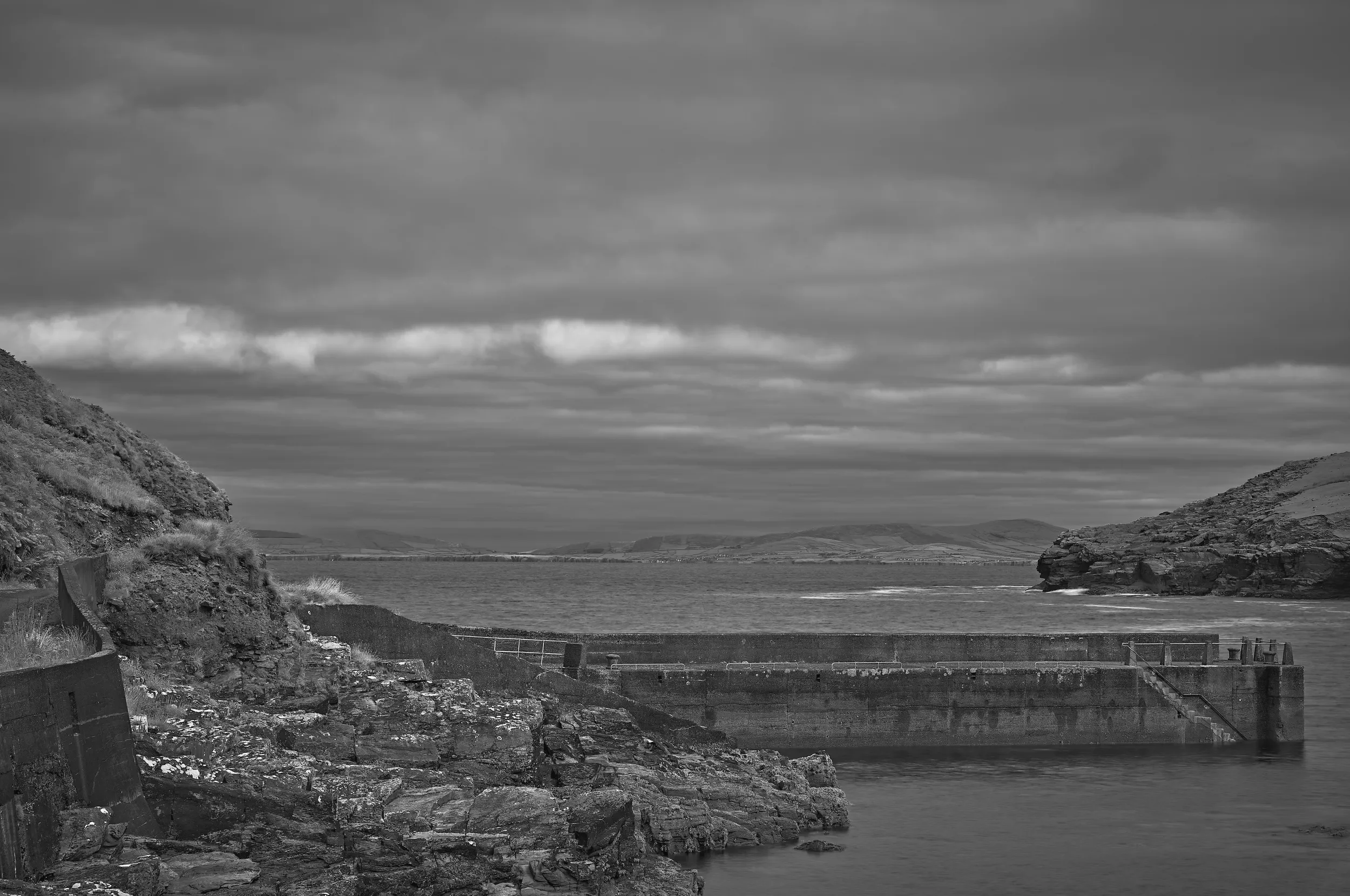  Between Land and Sea   / Sheltered pier overlooking the vast Atlantic horizon / Ring of Kerry, 2025   IRP-001