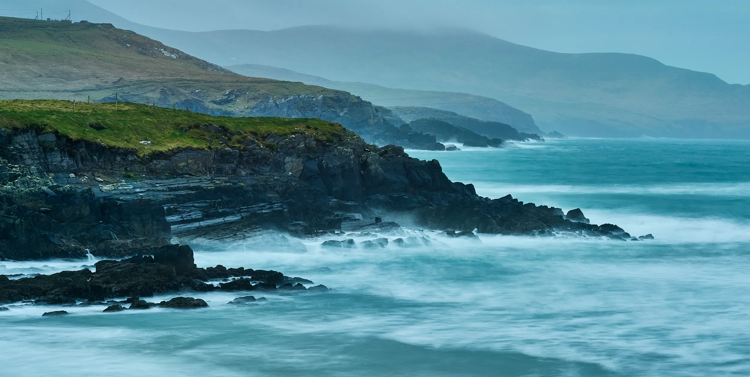   Receding Shores   / Layered headlands and the rhythmic interplay of surf and sea spray, St. Finian’s Bay / Region, 2024   KYI-057