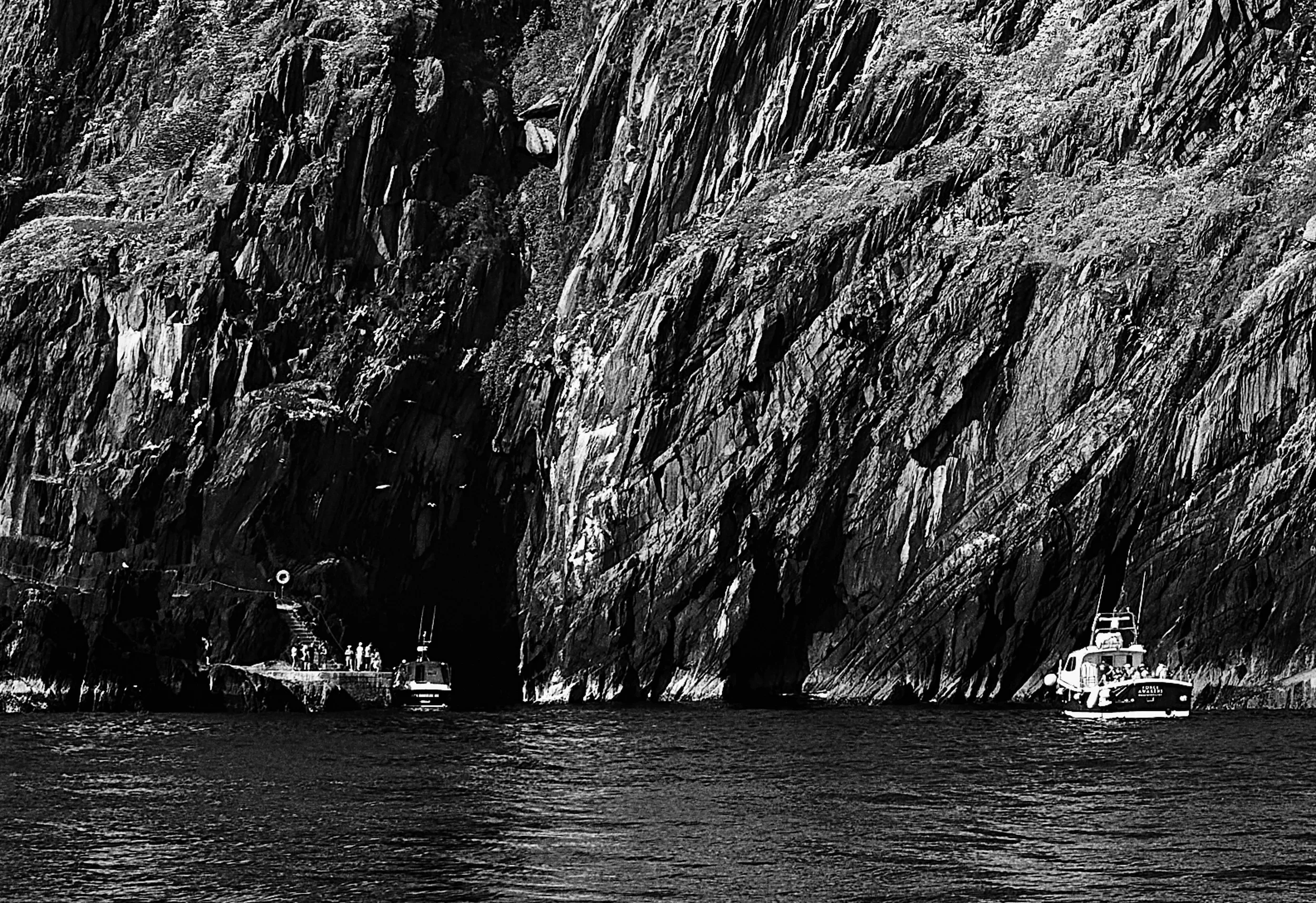 A closer look reveals remarkable detail, from visitors making their way ashore …