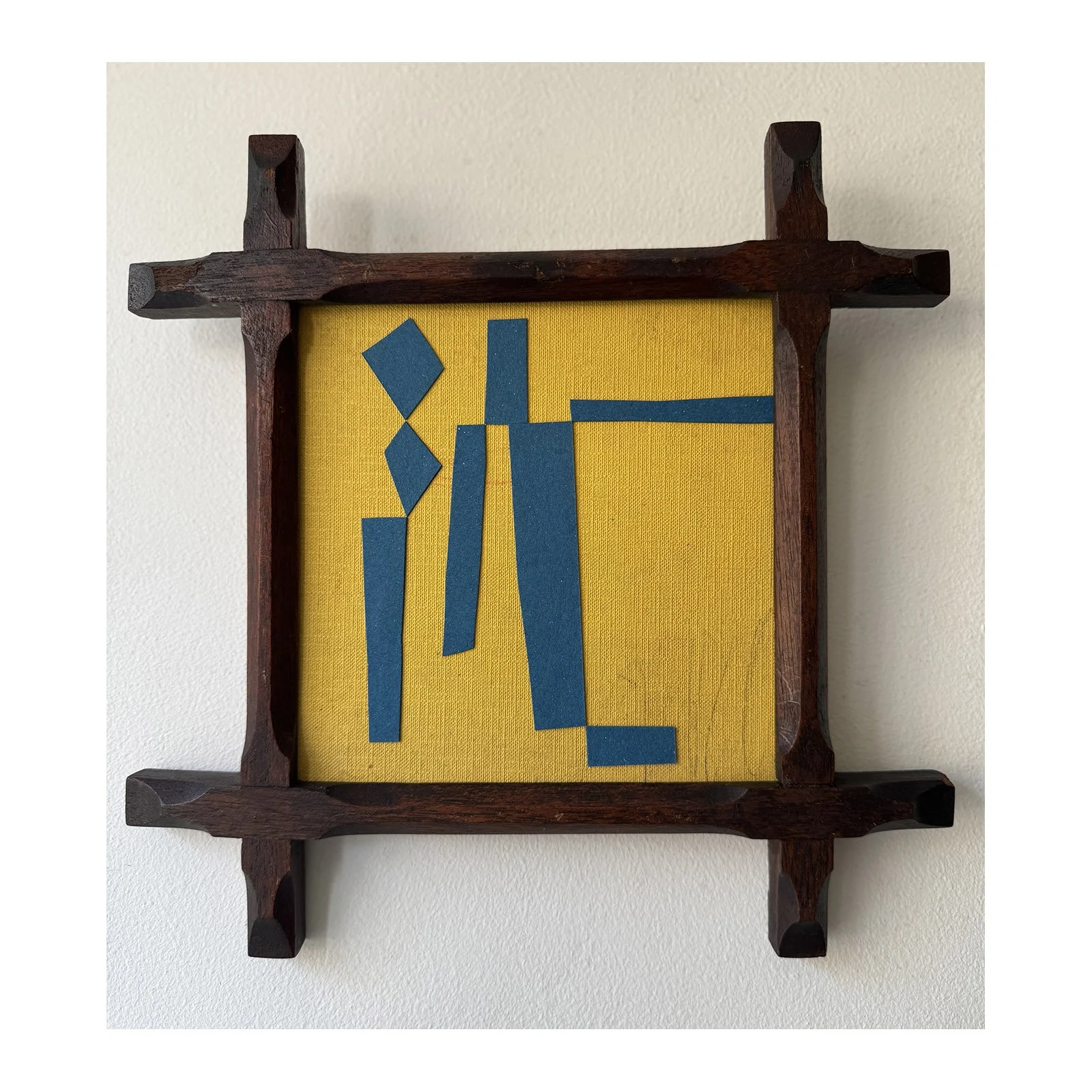 Blue and yellow collage using found materials in a reclaimed vintage frame by British contemporary artist Lauri Hopkins