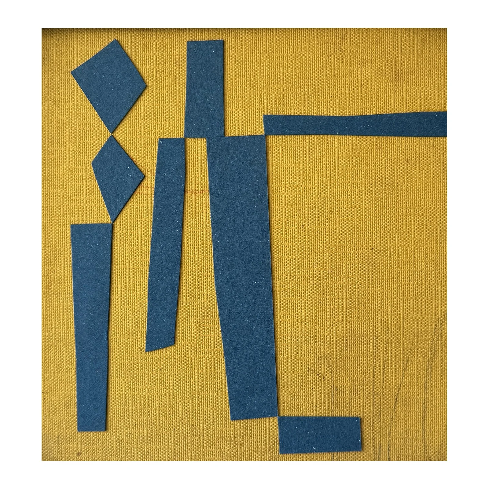 Blue and yellow collage using found materials in a reclaimed vintage frame by British contemporary artist Lauri Hopkins