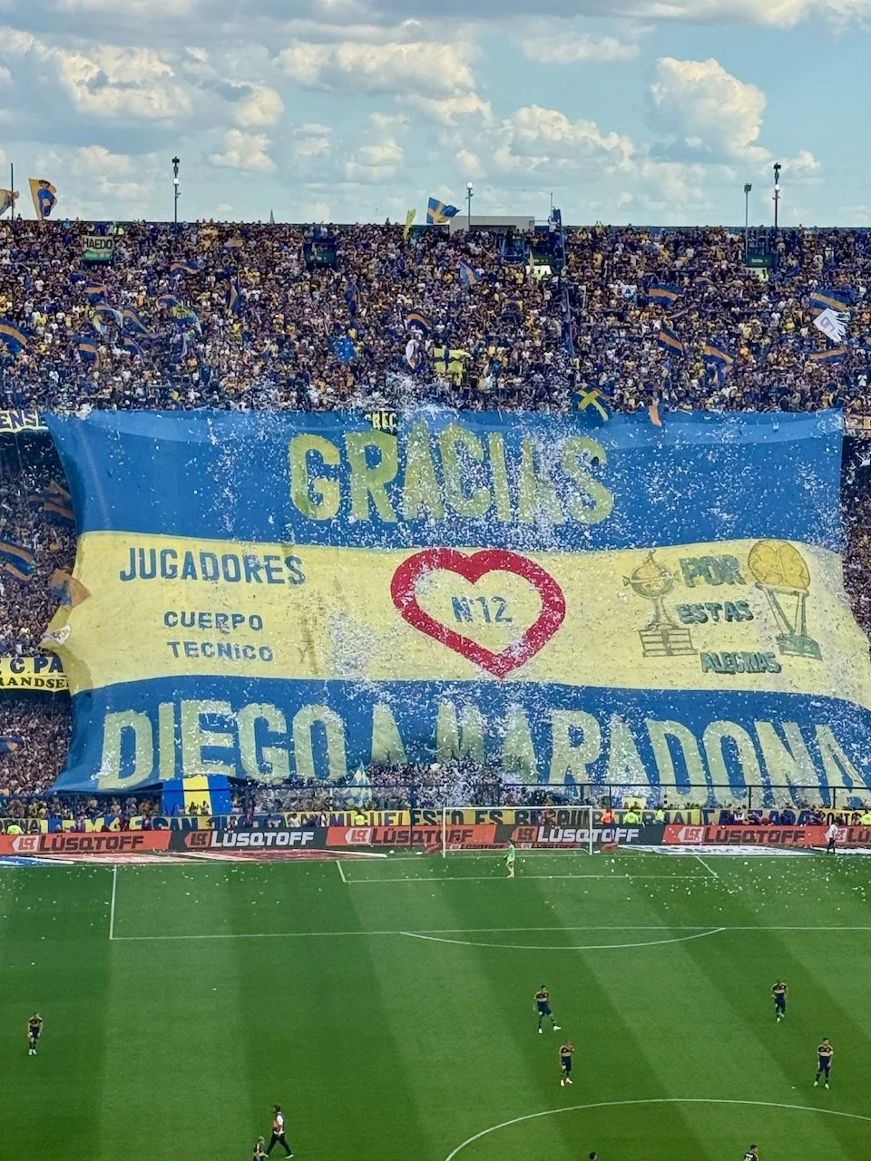 The white pieces of paper flew throughout the game. Our guide said that when he was growing up, kids would save all the scrap paper from their school classrooms and bring it home to use on game days. 