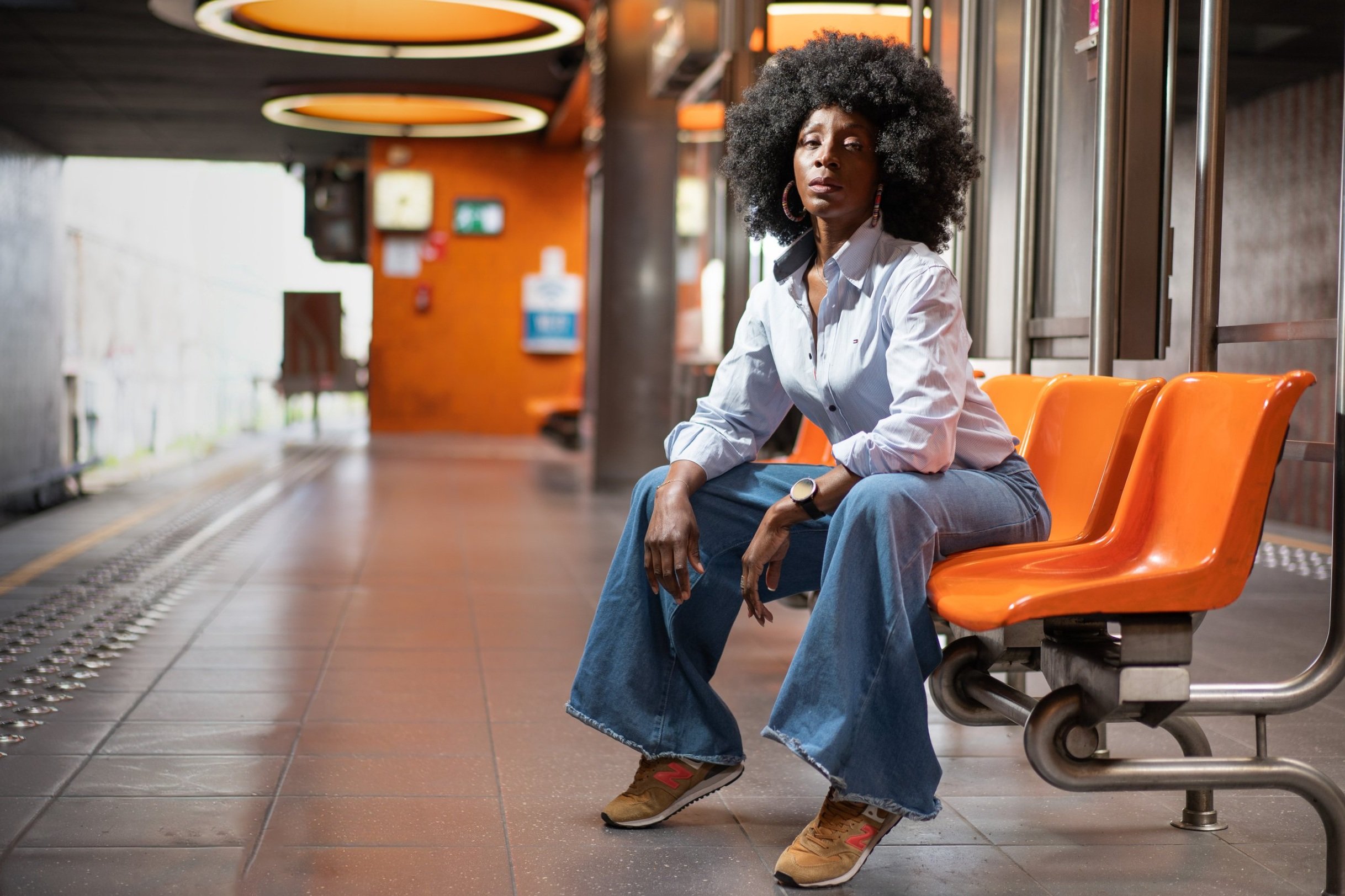 portrait of afro women sitting in the metro station