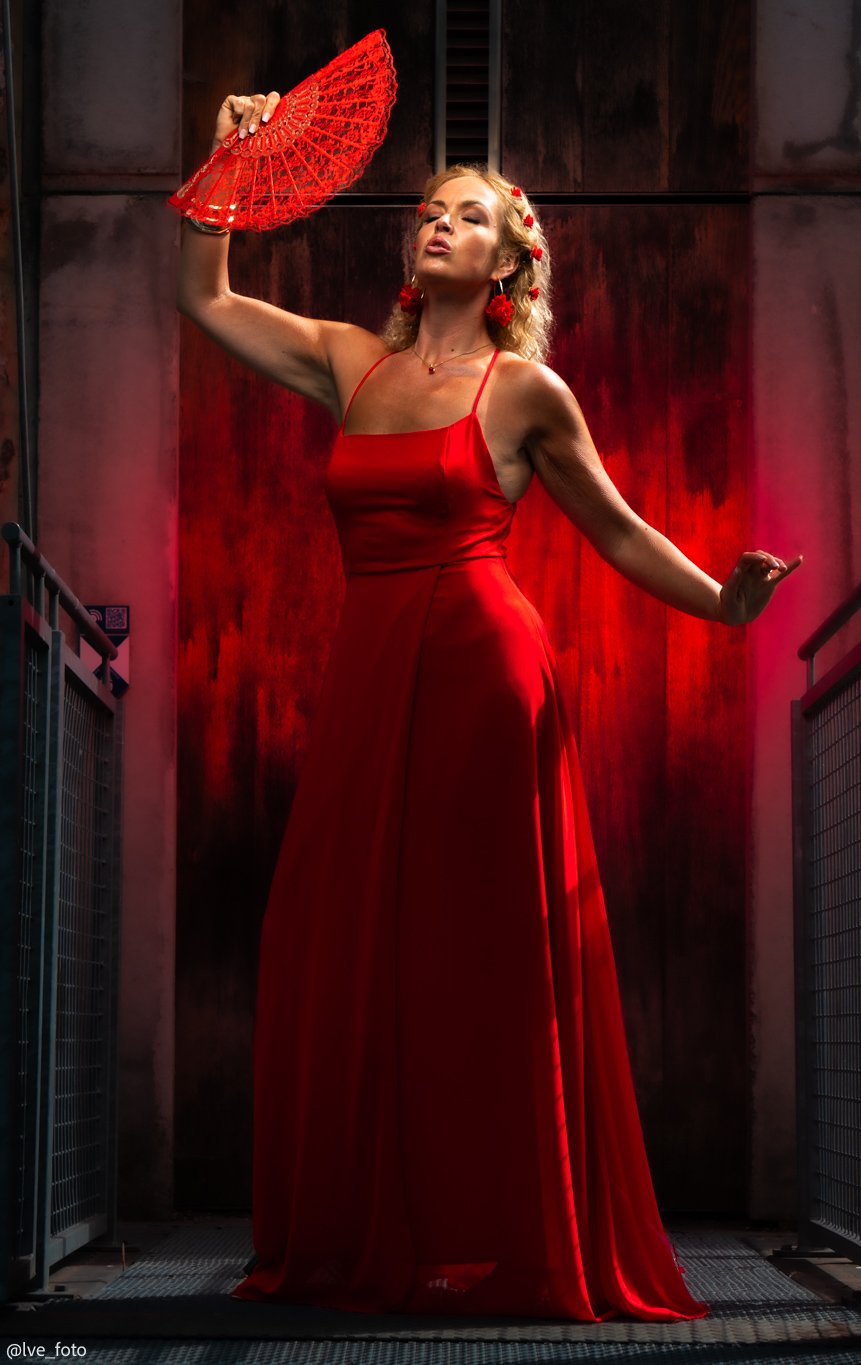 portrait of a blond women in red dress