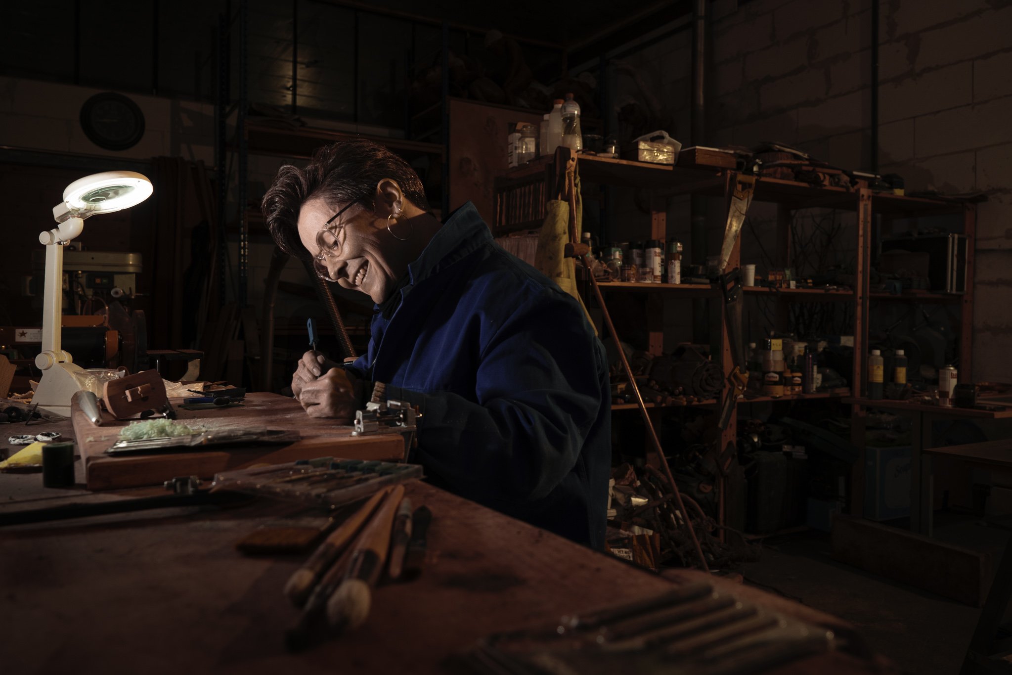 portrait of a woman in her workshop