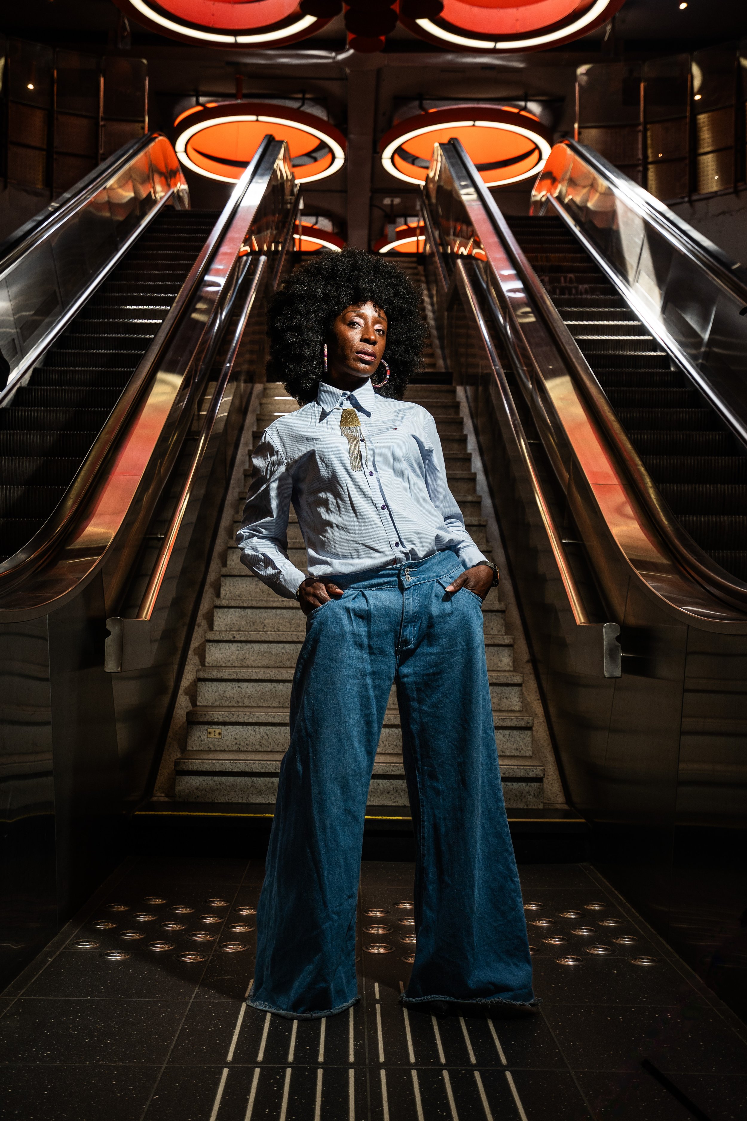portrait of a black afro women in a metro station