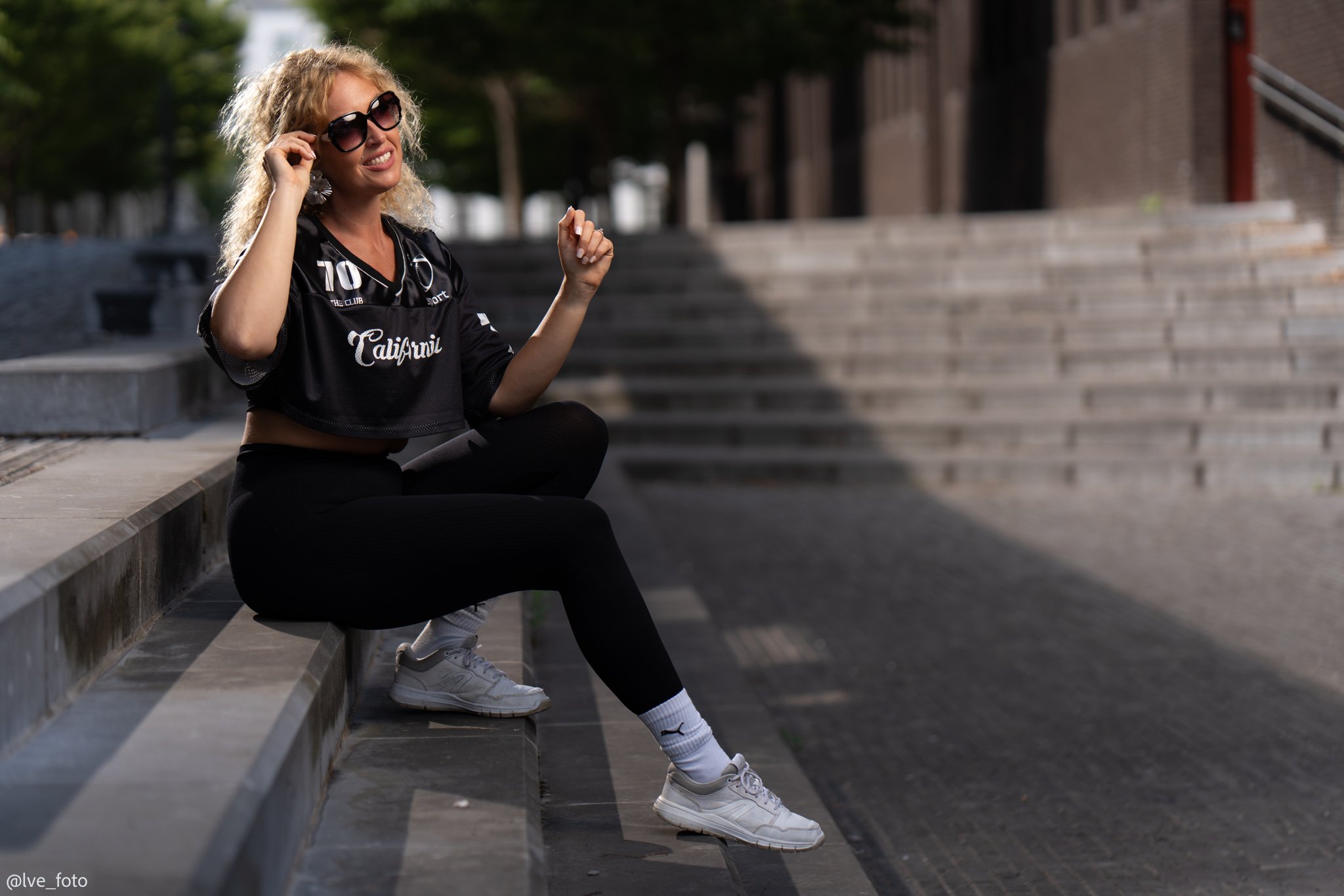 portrait of a woman sitting on the steps