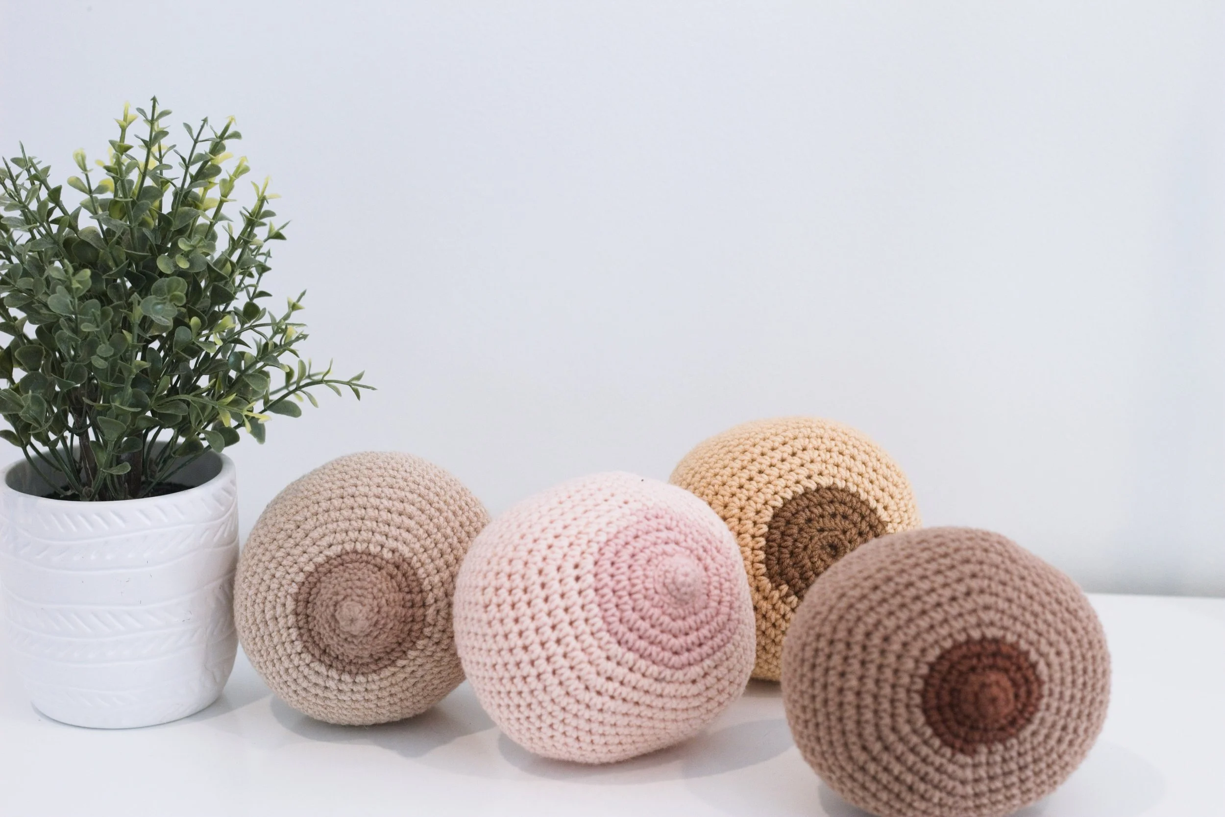 Crochet breasts that Katie Franklin uses as props to help her postpartum doula clients with breastfeeding