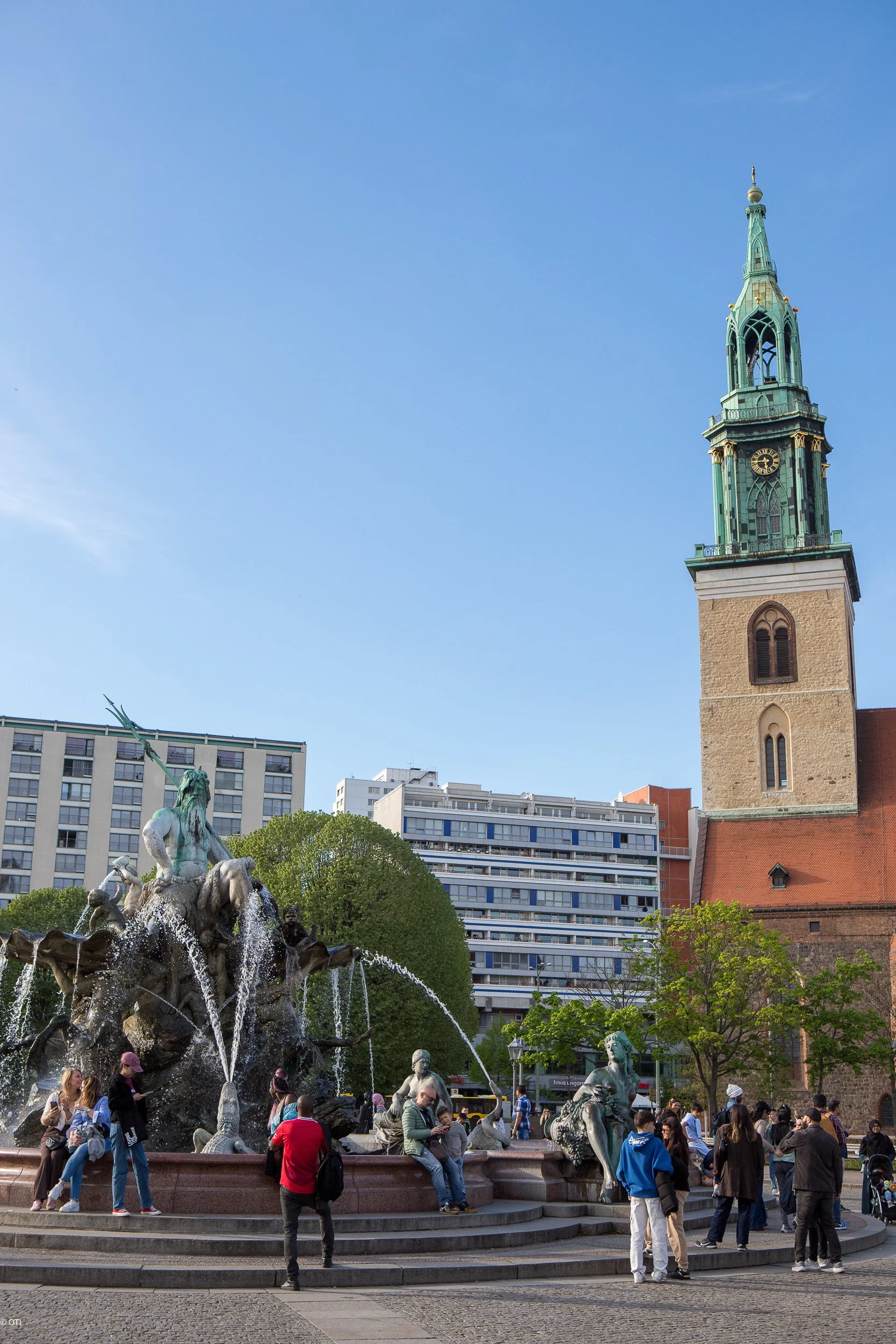 Neptune Fountain and Saint Mary's Church in Berlin, Germany.