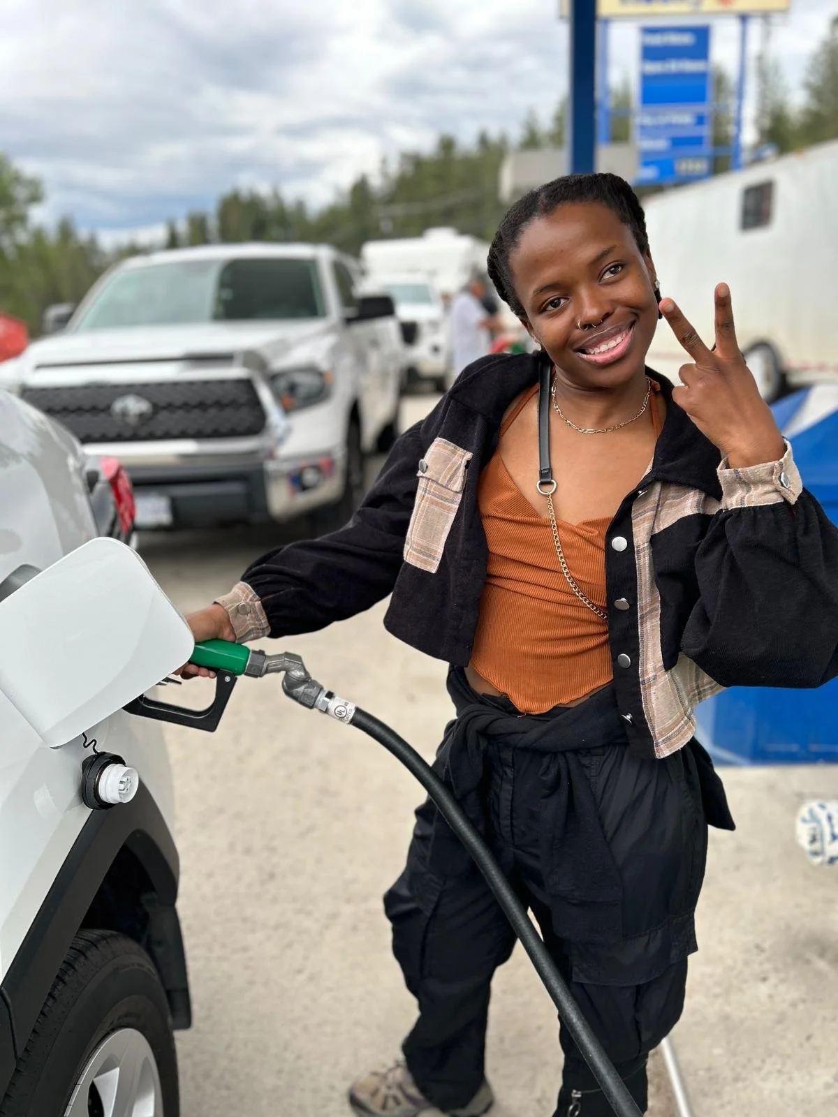 Lebo Mabusela filling up on gas on the roadtrip to SAR