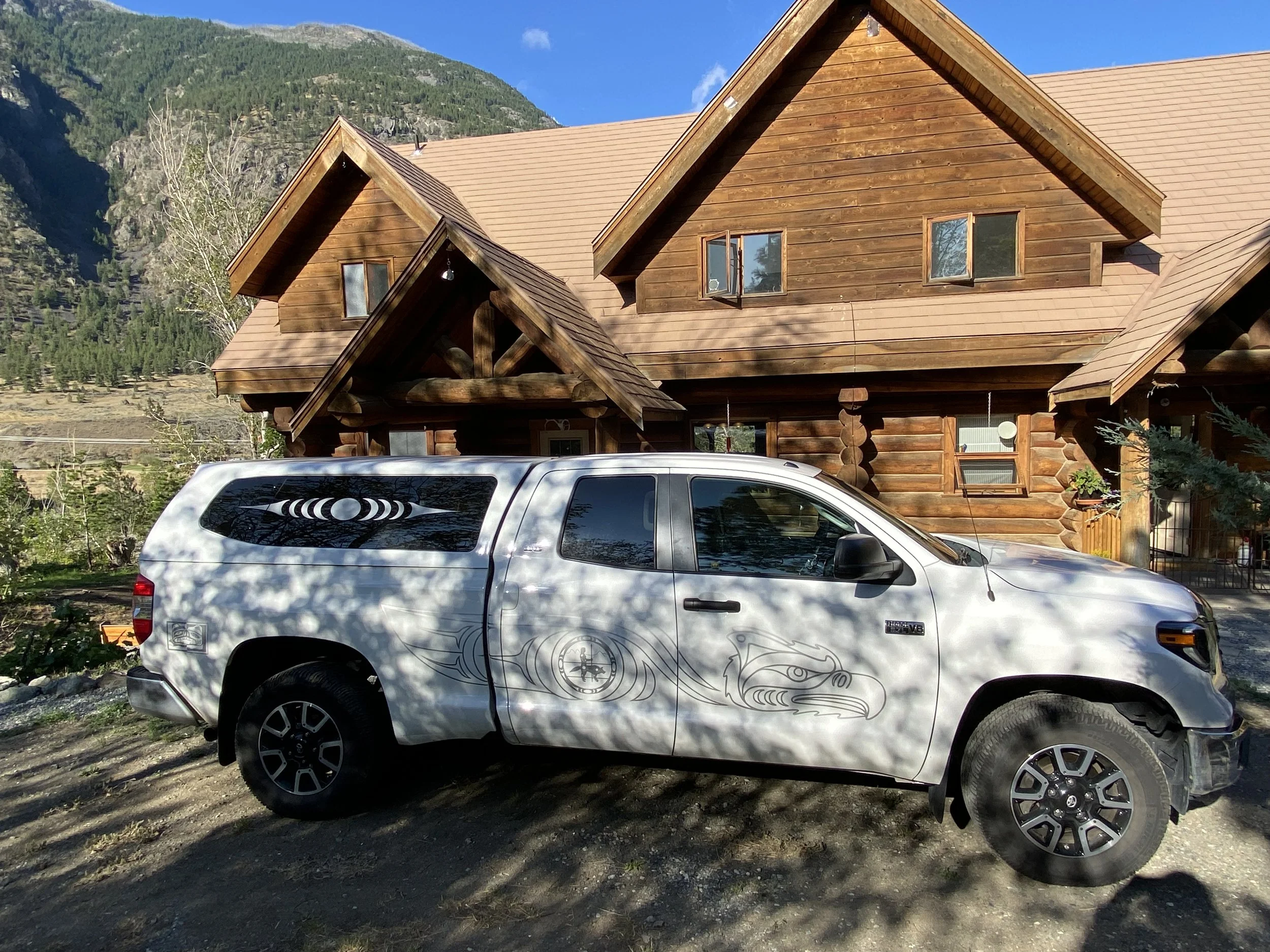 Xwalacktun's truck outside of the Log House