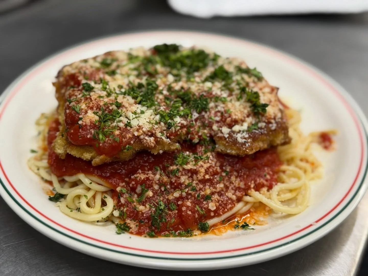 It&rsquo;s Thursday, and you know what that means&hellip; our Chicken Parmesan special is available all day. ⭐️

Crispy hand breaded chicken topped with marinara, parmesan, and fresh herbs, served over a bed of spaghetti. Simple, classic, and always 