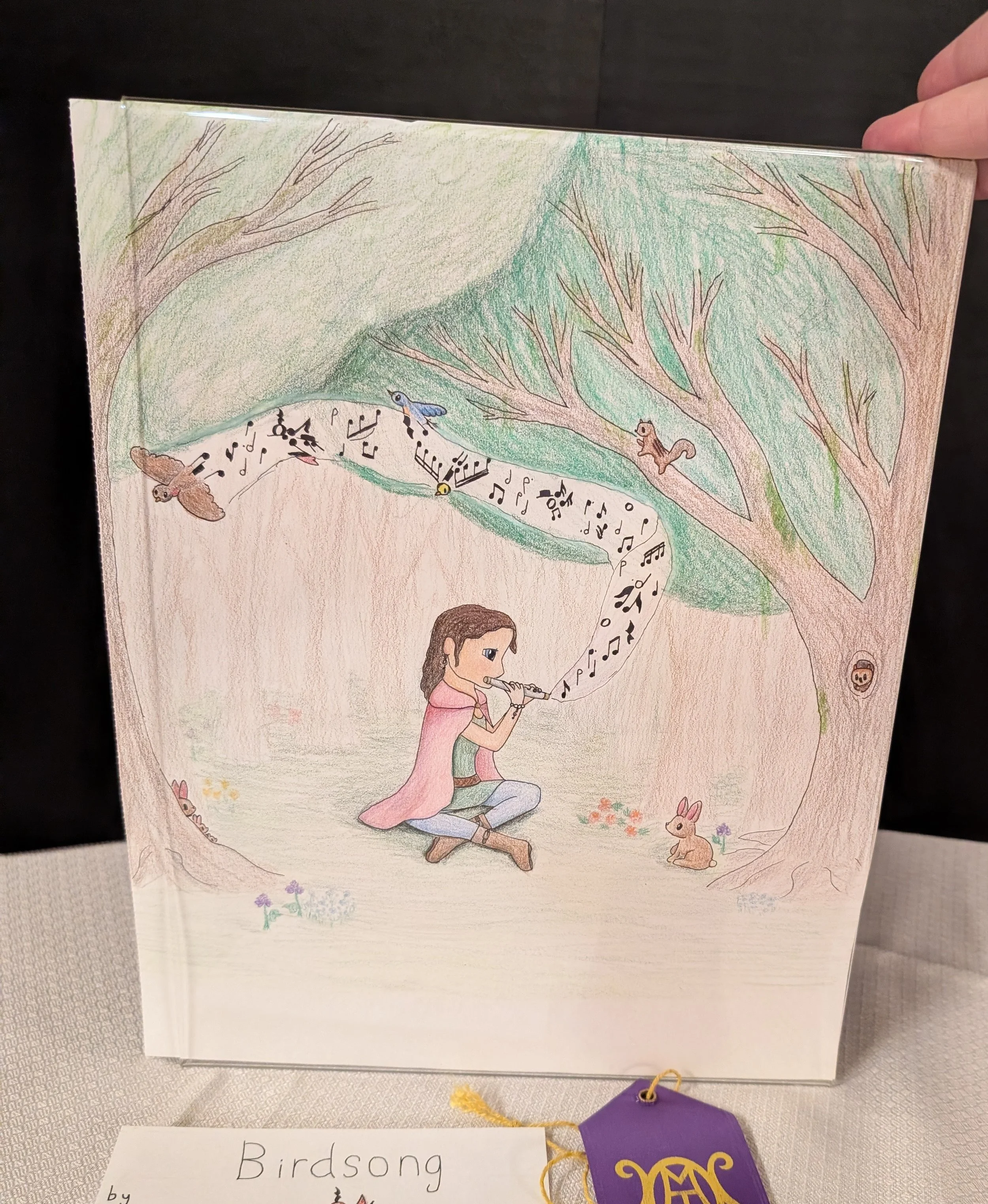 Titled Birdsong, drawing shows a flutist in the woods with birds.