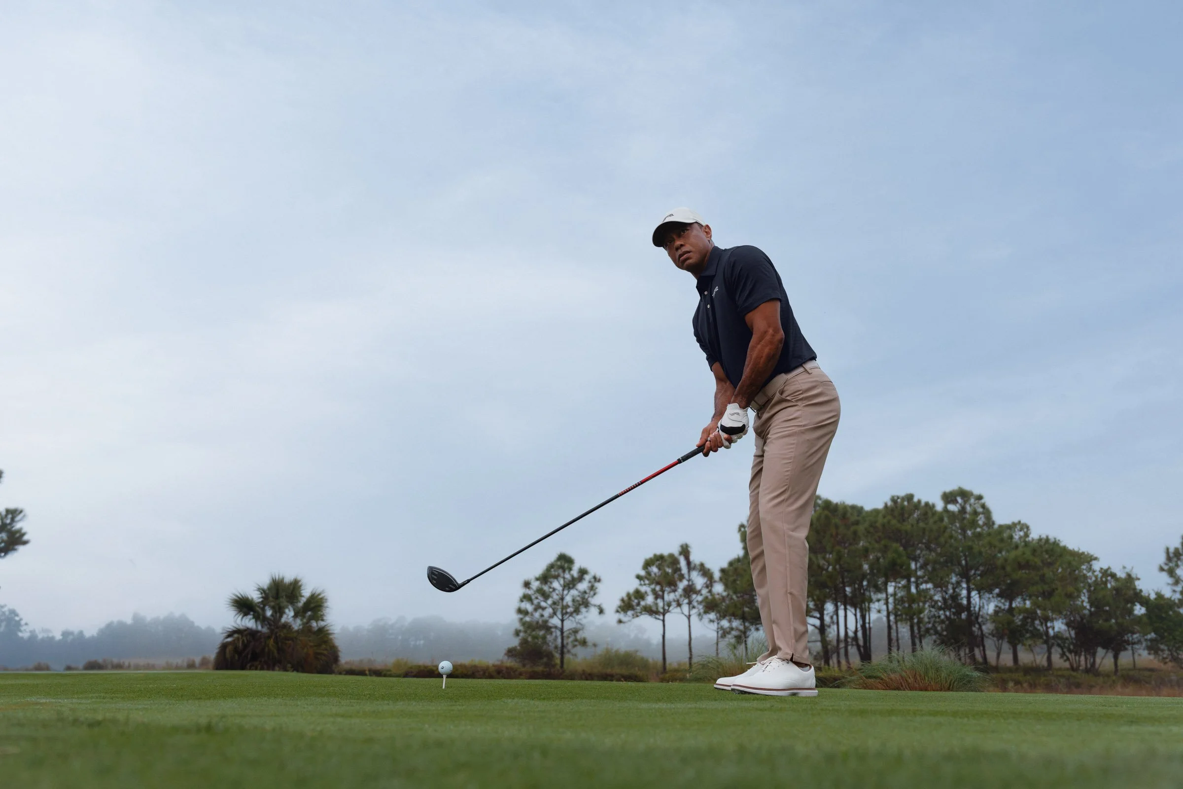 Tiger Woods photographed for a premium golf apparel brand, Sun Day Red, advertising campaign by Los Angeles commercial photographer Garrett Byrum. Golf advertising photographer.