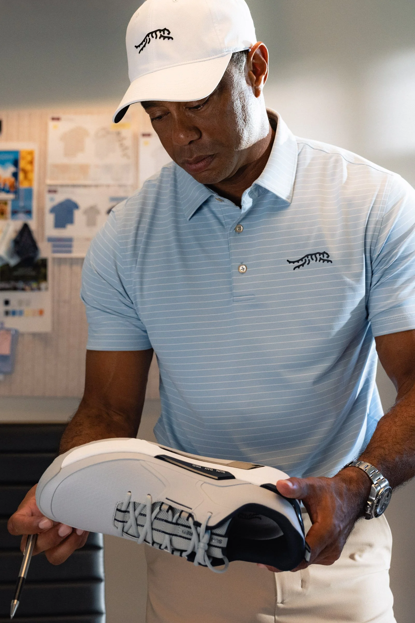 Tiger Woods photographed for a premium golf apparel brand, Sun Day Red, advertising campaign by Los Angeles commercial photographer Garrett Byrum. Golf advertising photographer.