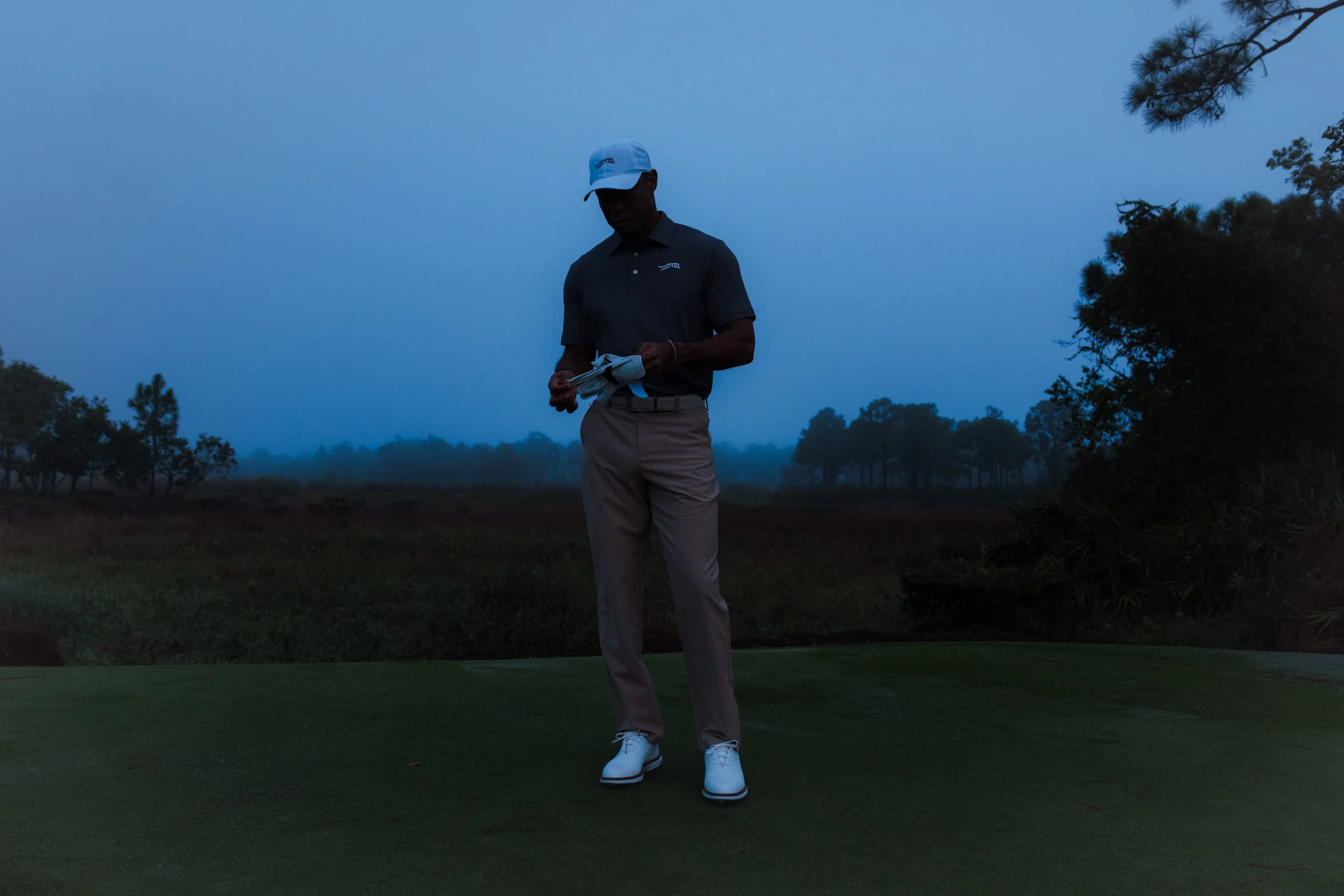 Tiger Woods photographed for a premium golf apparel brand, Sun Day Red, advertising campaign by Los Angeles commercial photographer Garrett Byrum. Golf advertising photographer.