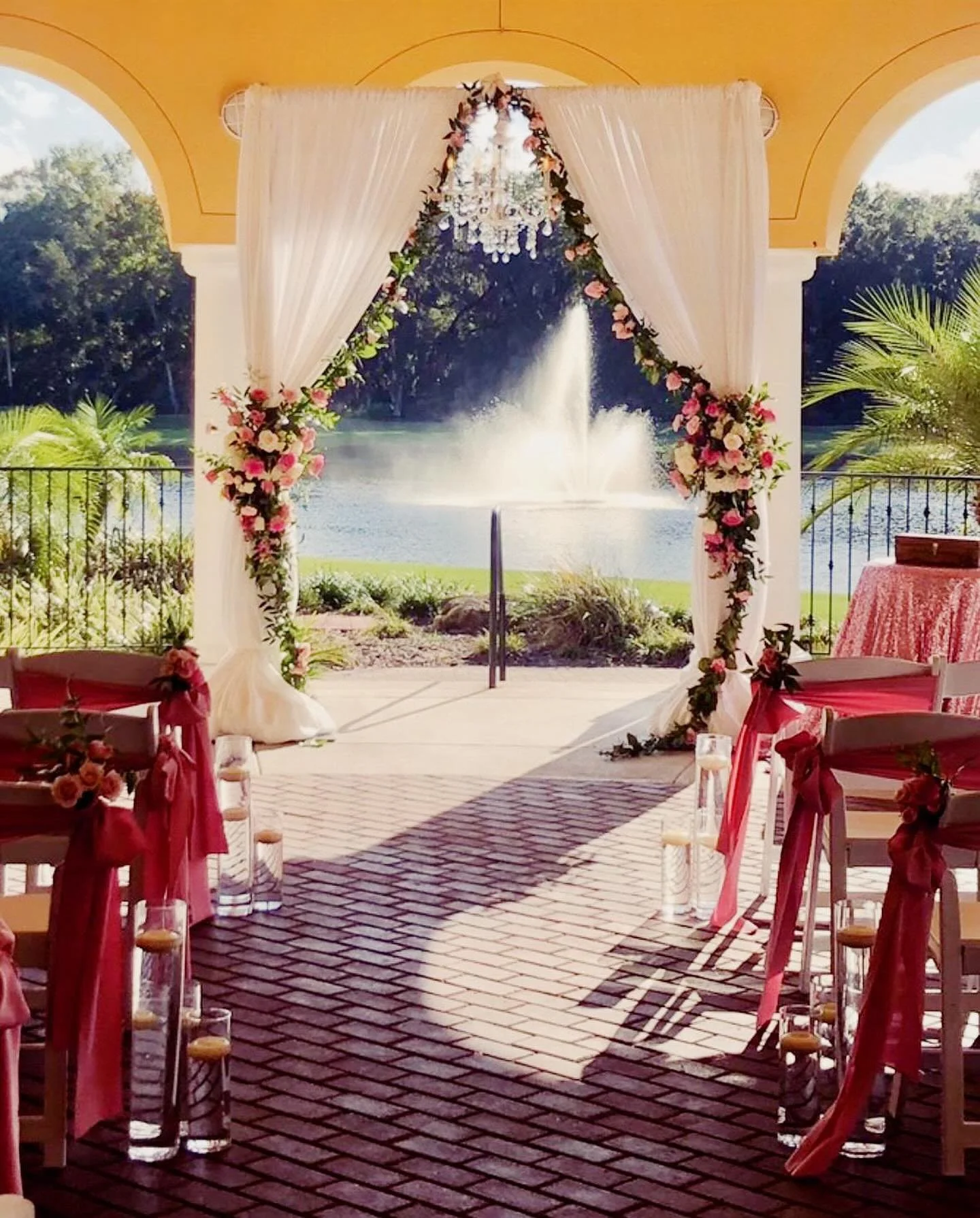 Our Draped Arch Backdrop with Chandelier is a popular ceremony backdrop option! ————————————————————————&m
