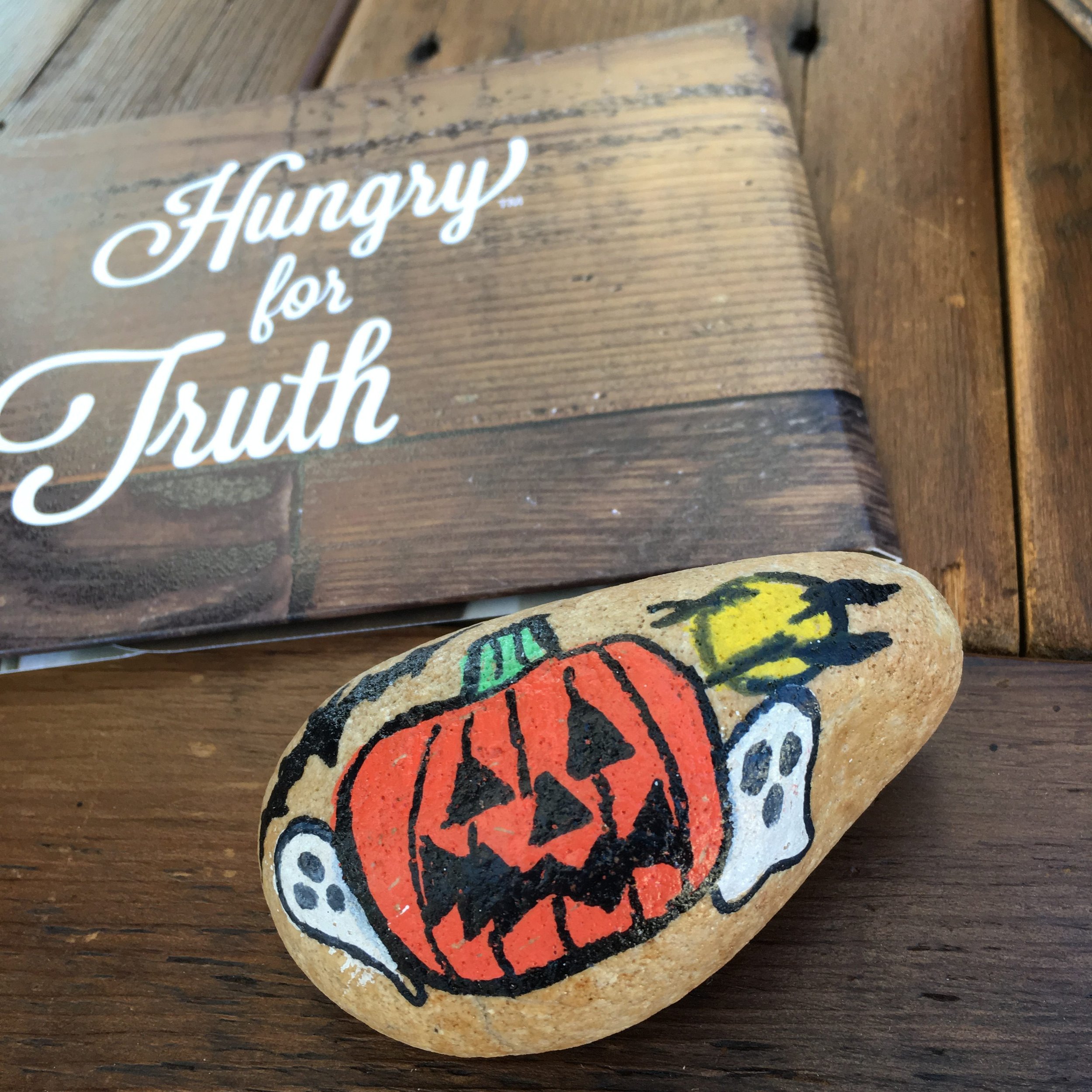 pumpkin painted on rock